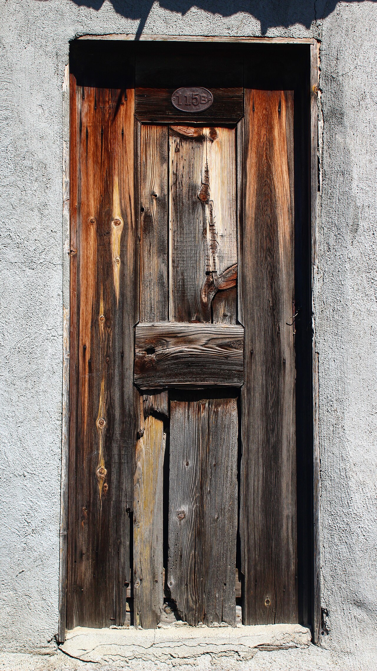 An old wooden door with a worn frame