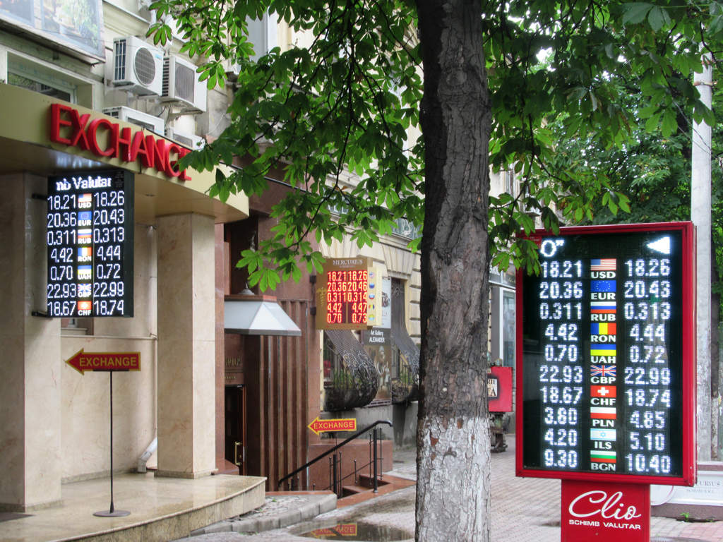 A currency exchange booth displaying its rates to passersby