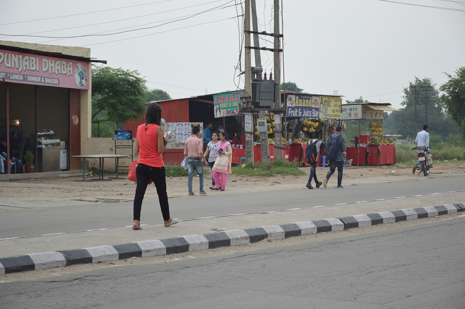 A woman using a smartphone while walking