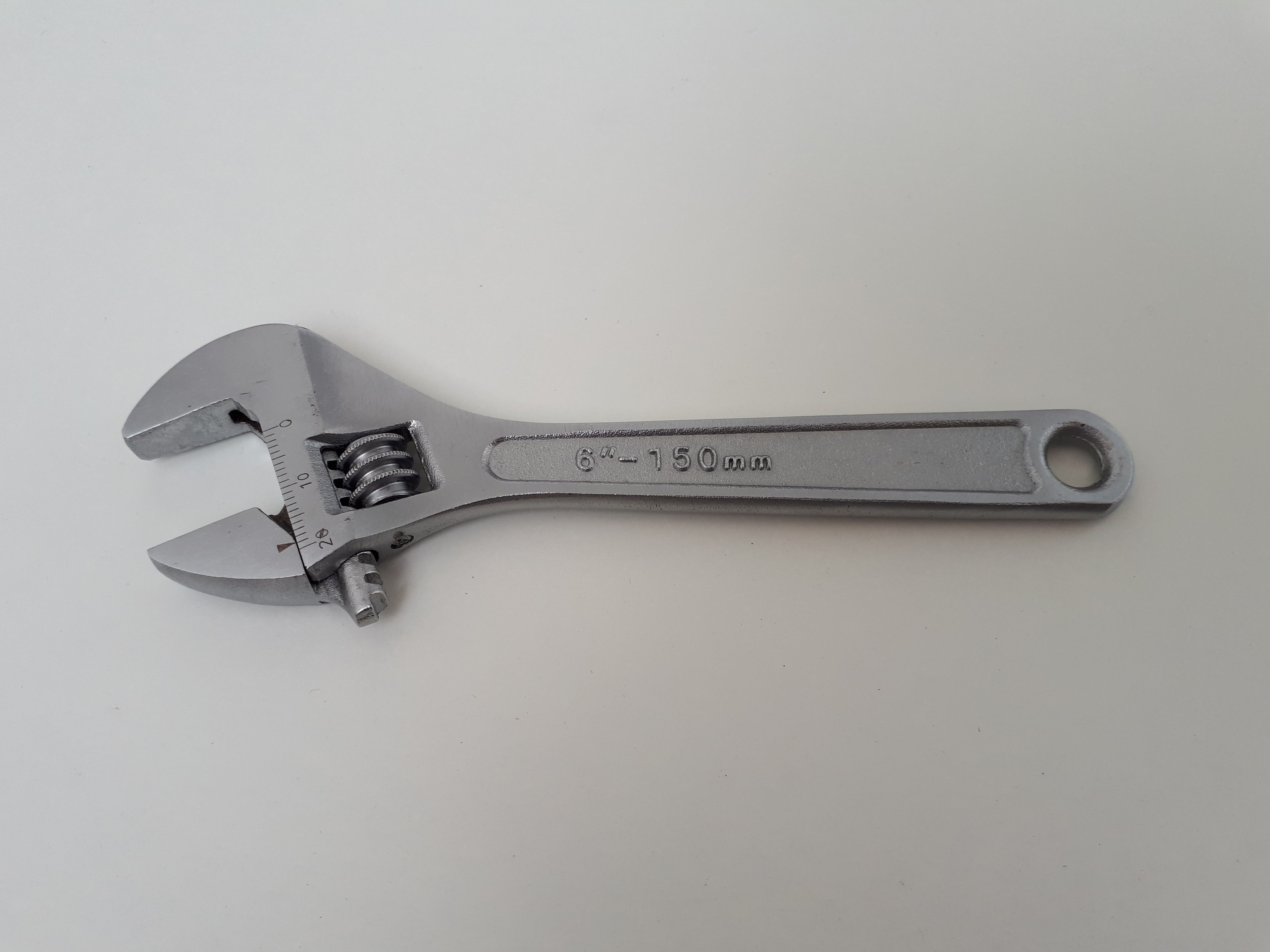 An adjustable wrench, a common tool for shower head repair