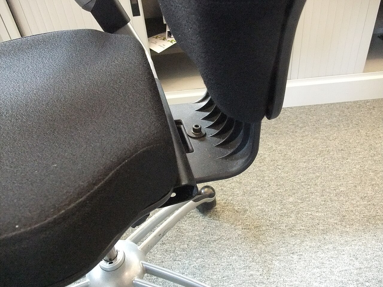 An office chair at a desk workstation