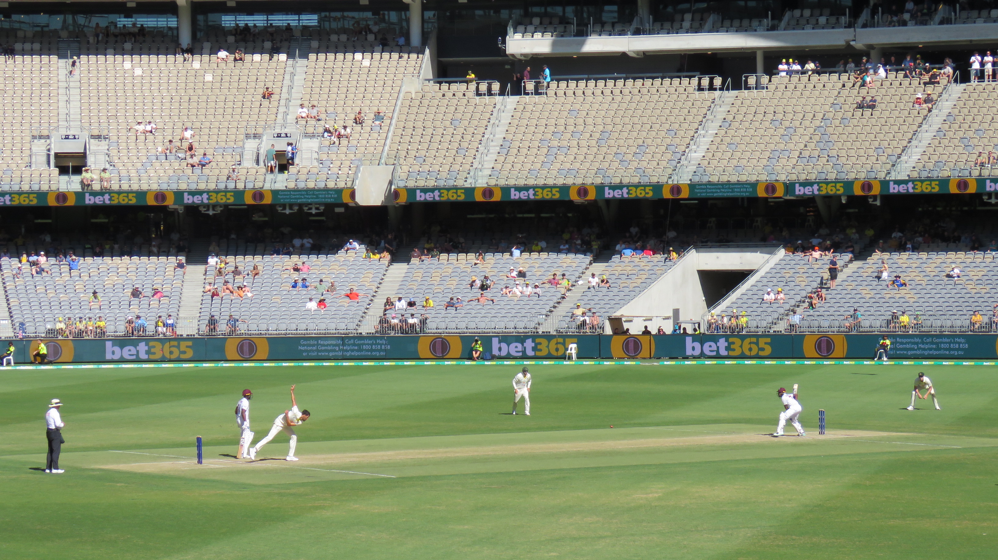 A batter plays a shot at a cricket ground in Australia