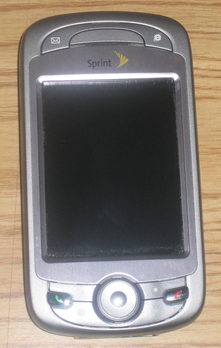 An older smartphone resting on a surface