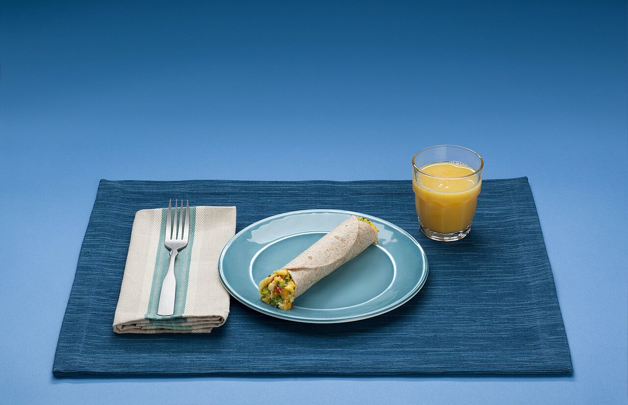 A balanced breakfast plate with eggs and vegetables