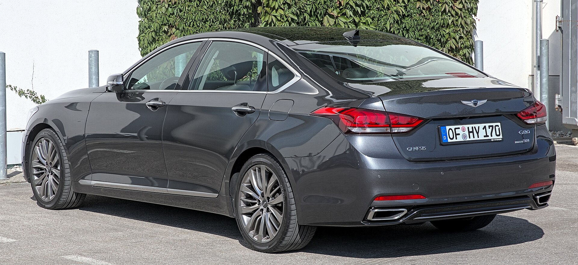 A Genesis G80 sedan seen from the side at a motor show