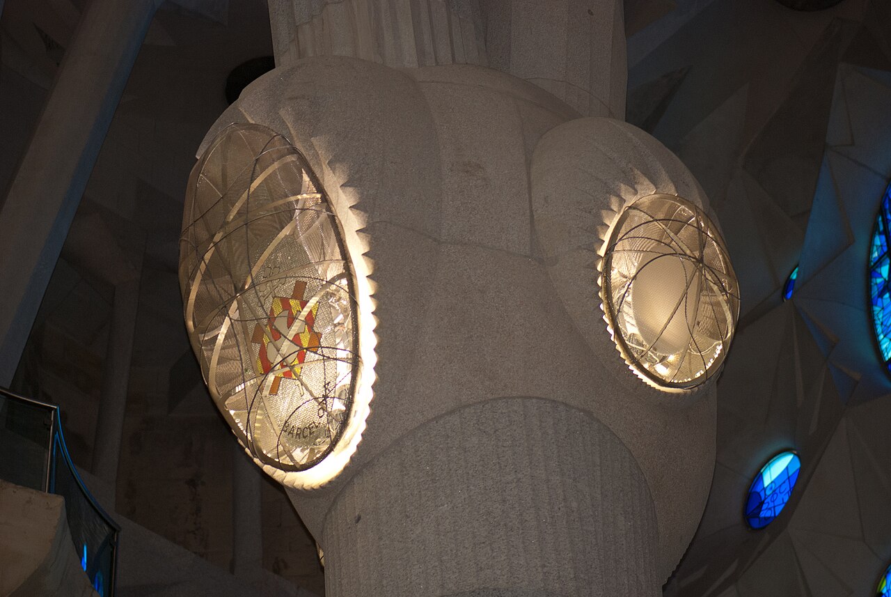 A light fixture glowing in a dark room