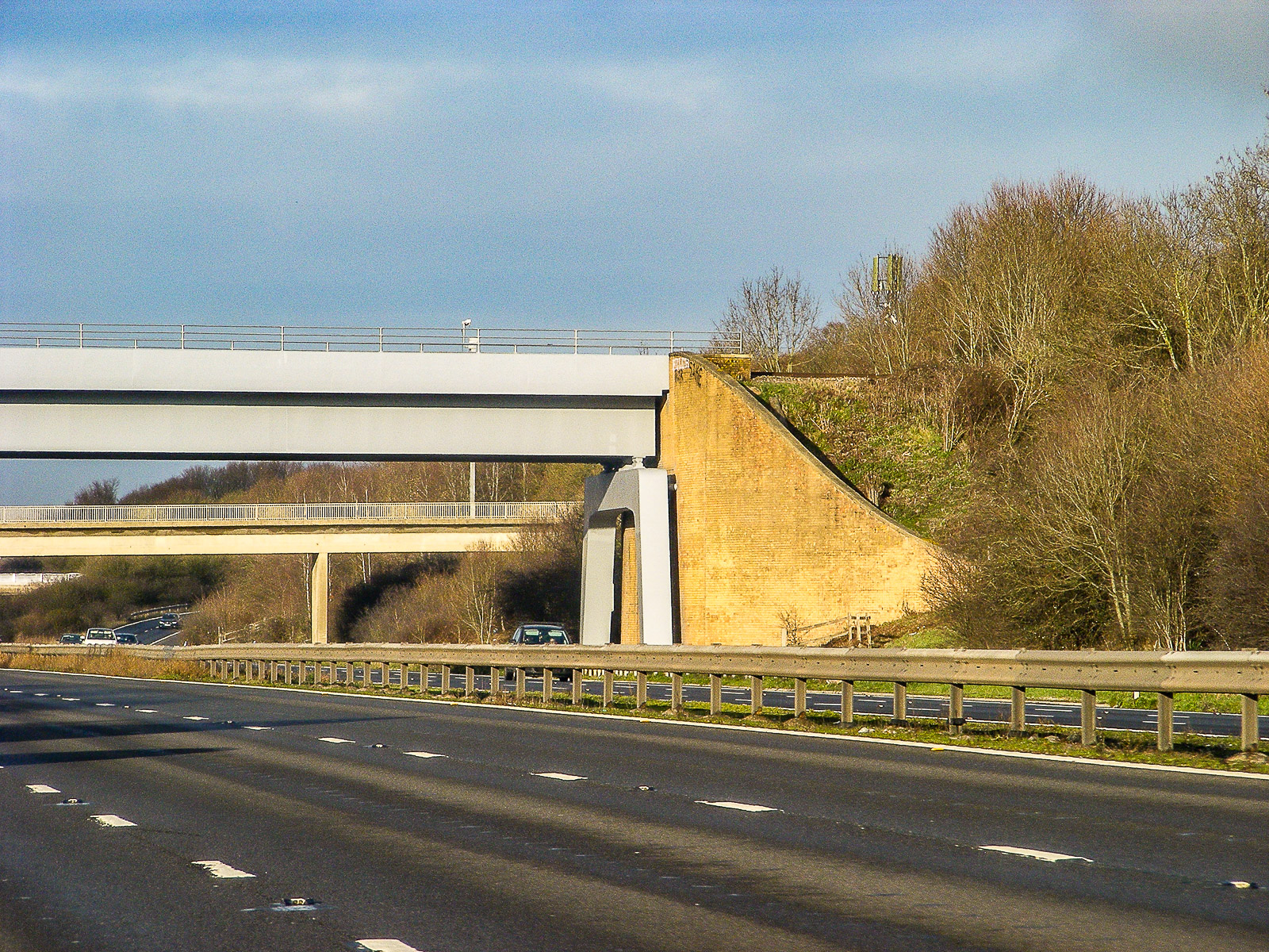 A railway viaduct crosses the M5 motorway near Cheltenham