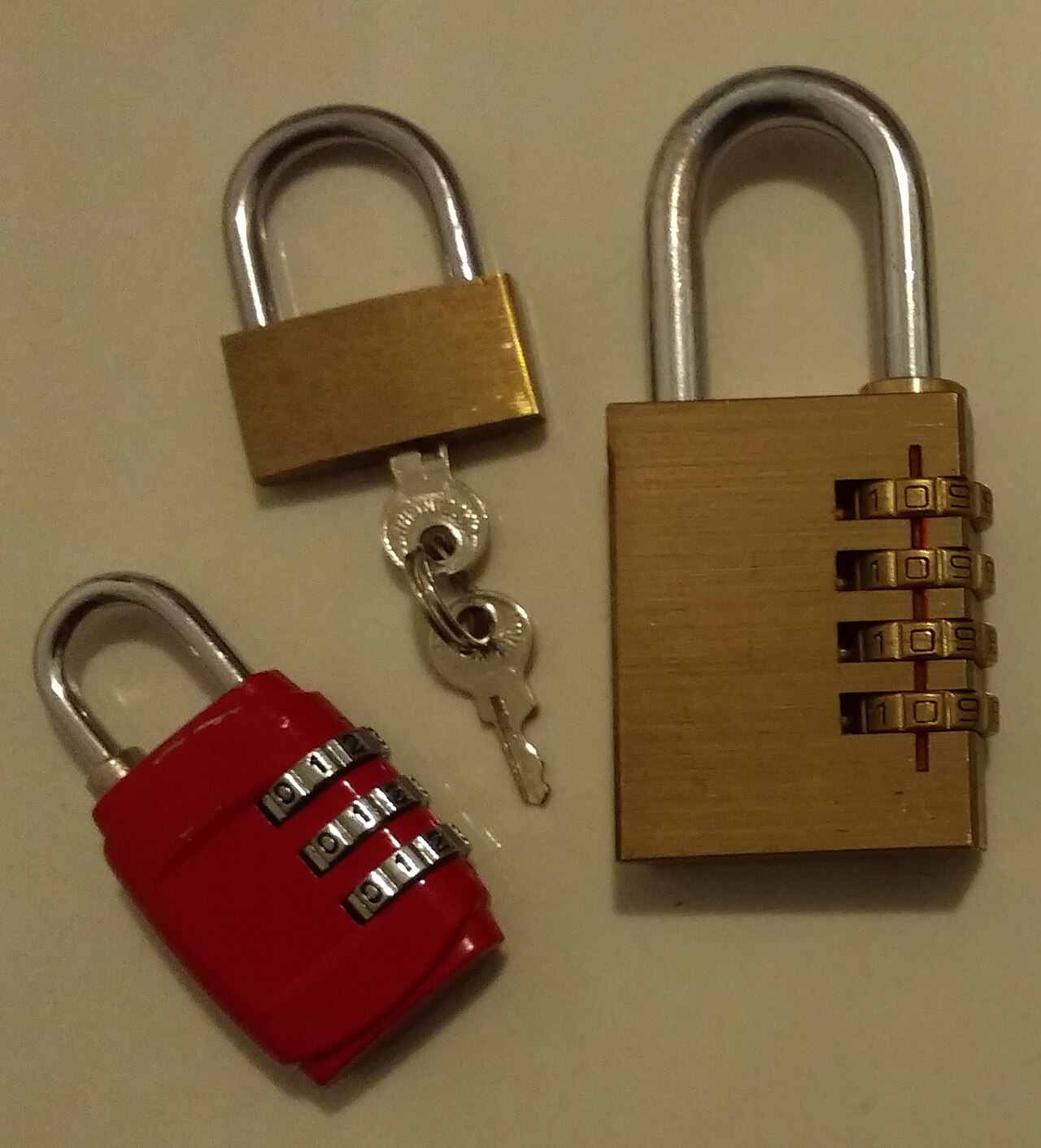 Three padlocks hanging in a row