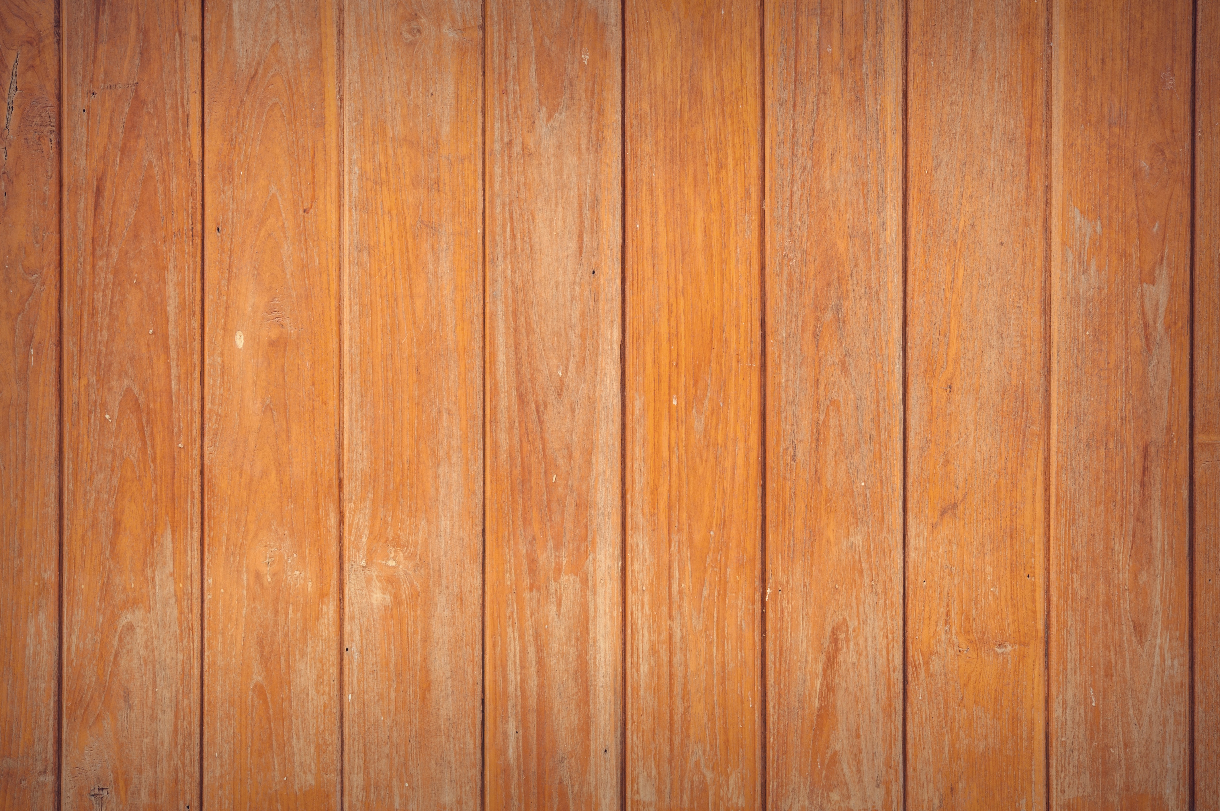 Worn parquet floorboards with visible gaps between boards