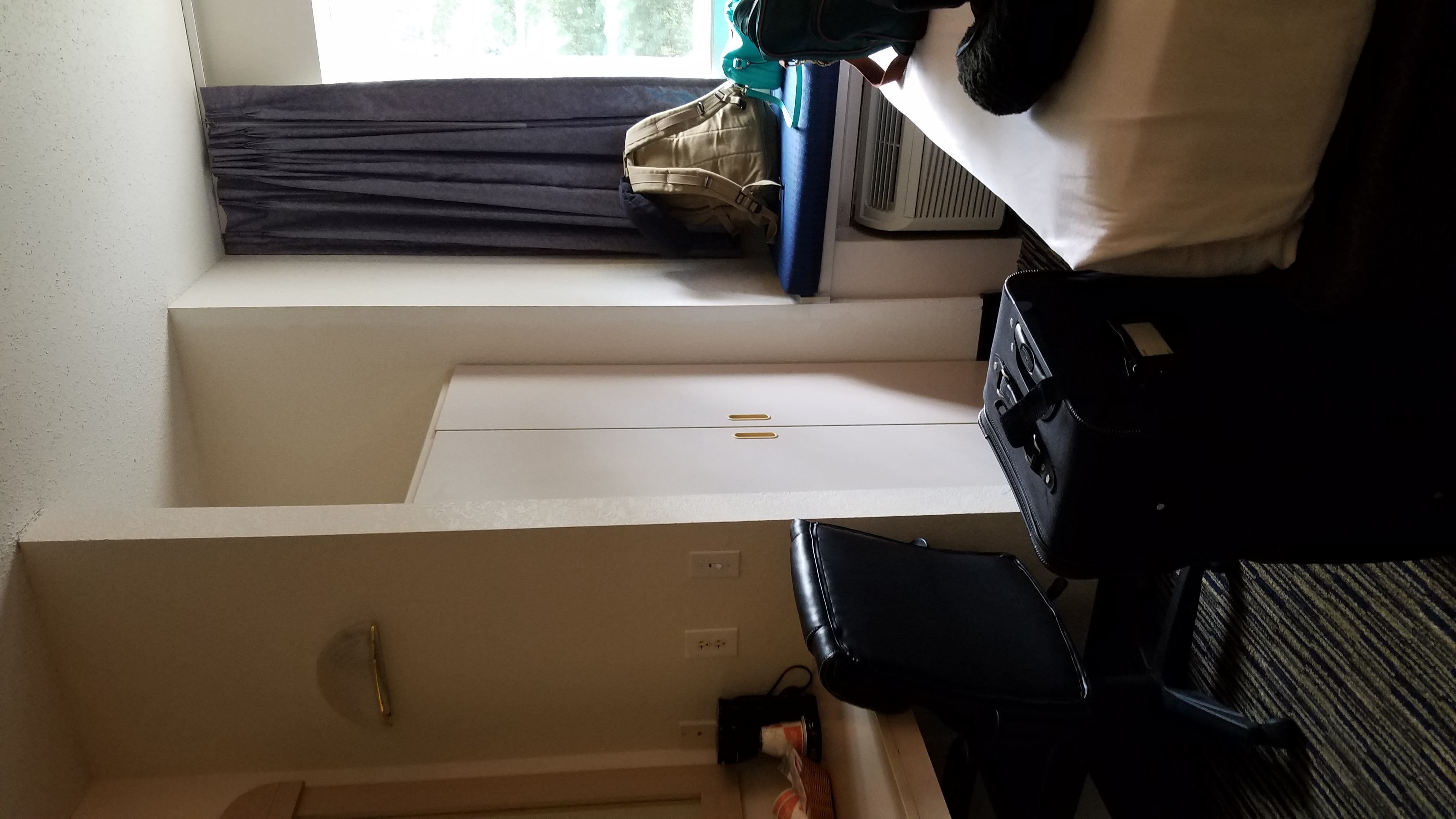 Hotel room with beds and a television