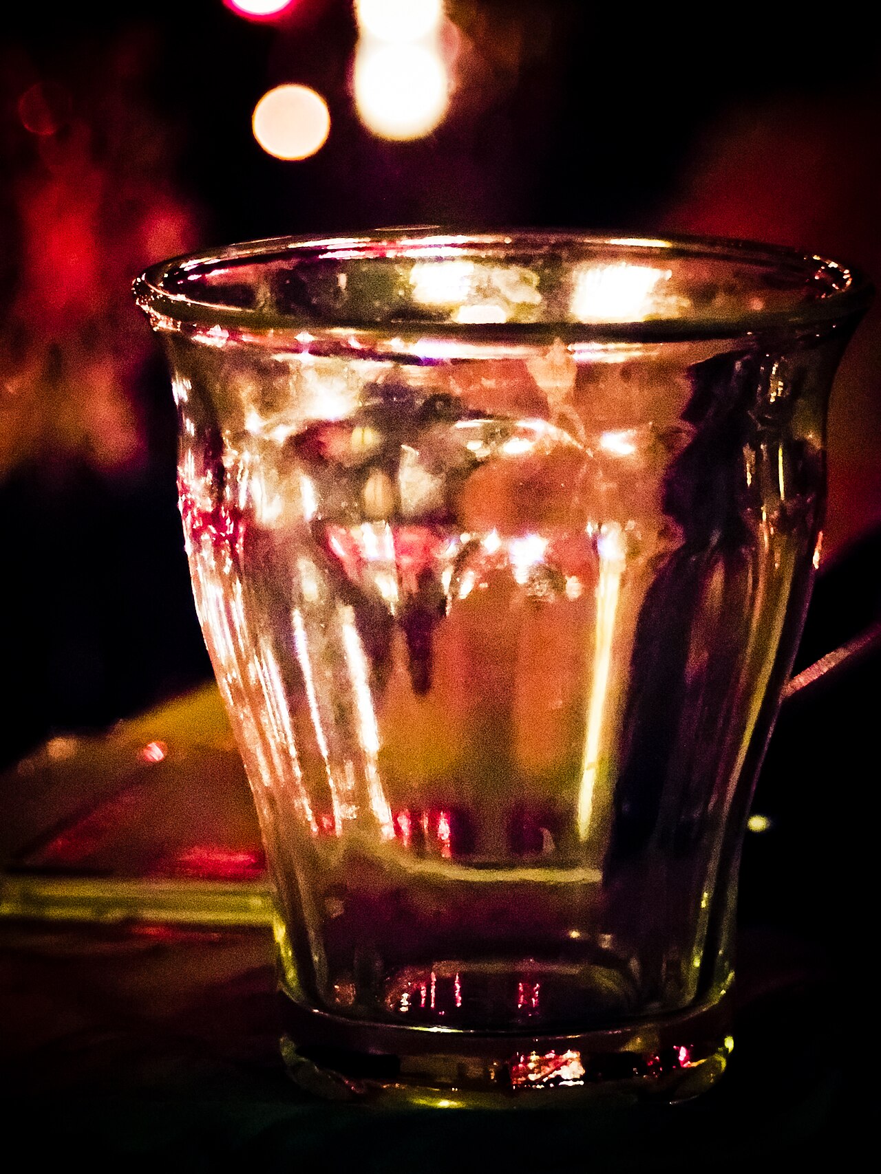 A clear glass of tap water standing on a table