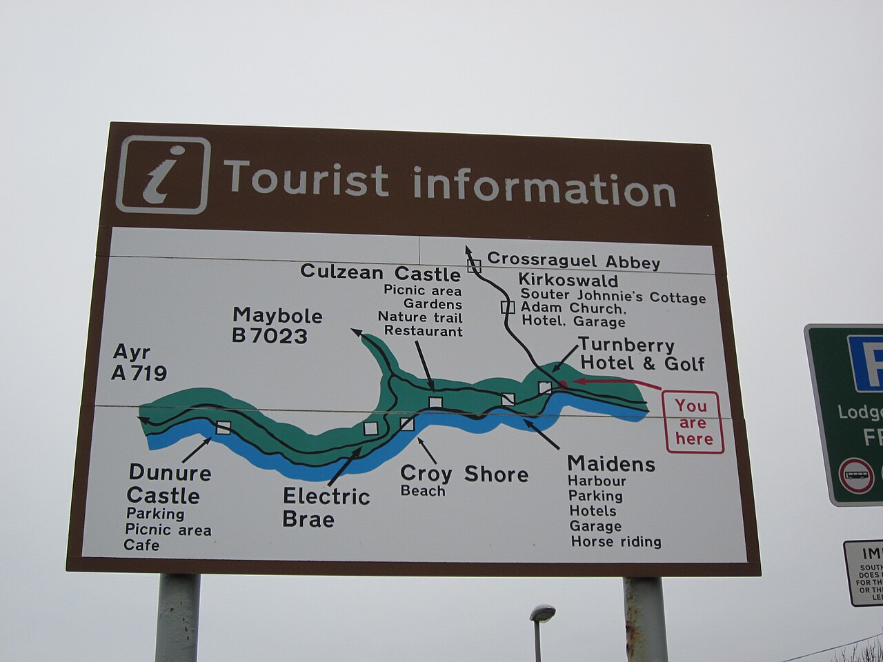 A tourist information sign on a street