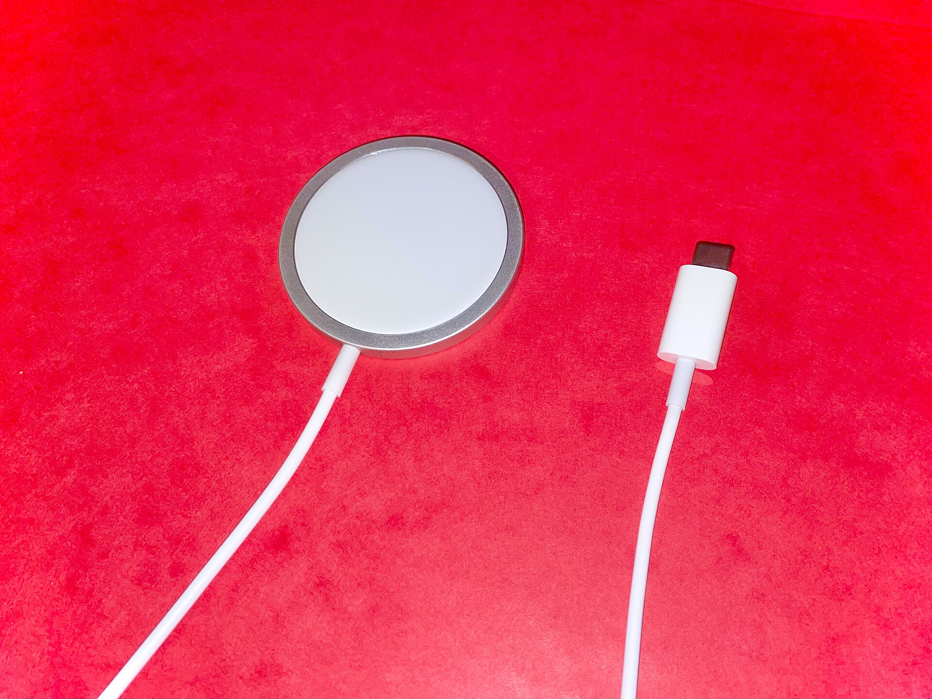 A MagSafe charger beside a USB-C cable