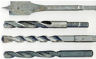 Four common drill bit shapes, including a flat spade bit and twist bits