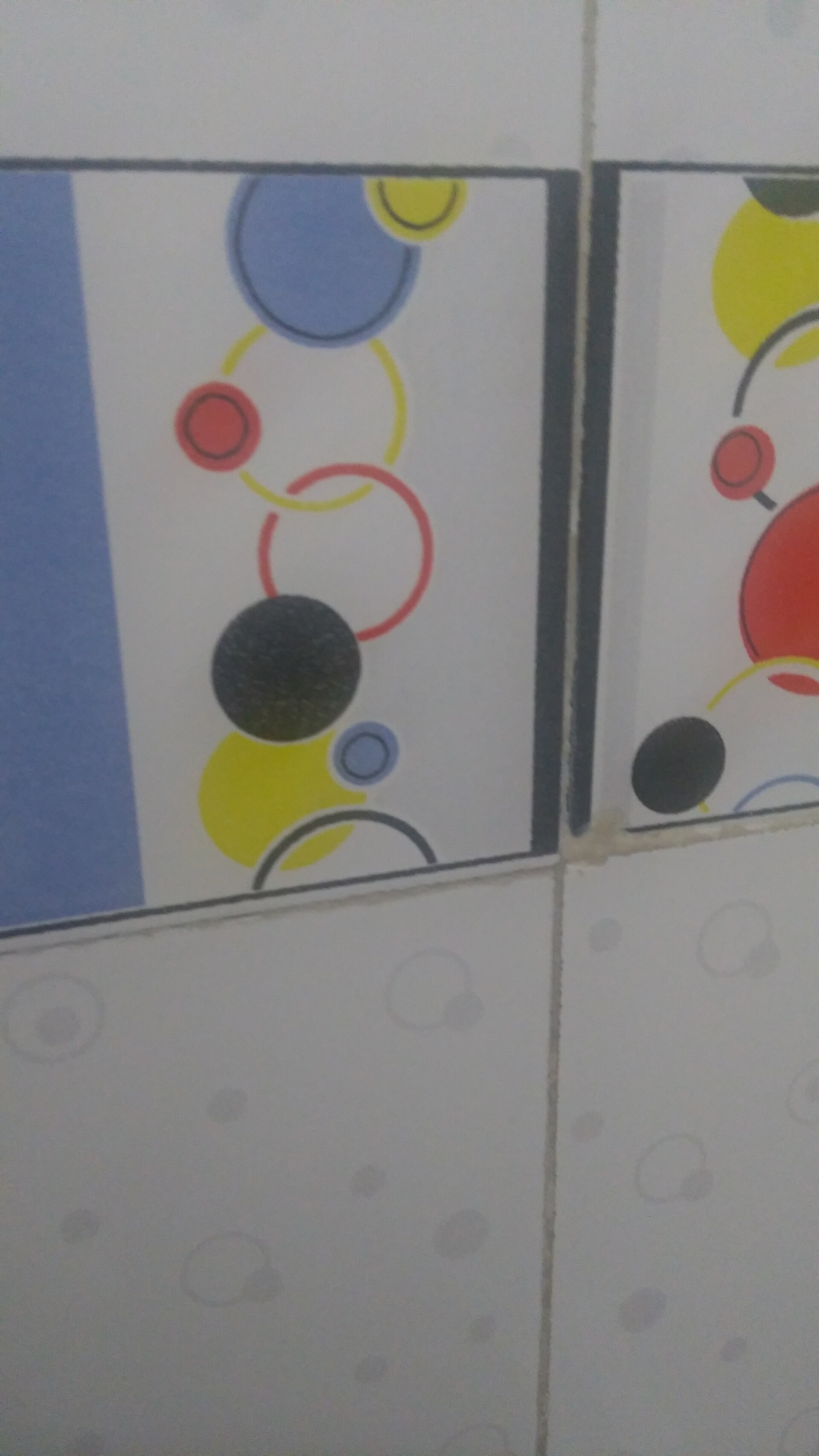 Patterned wall tiles with visible grout lines in close-up