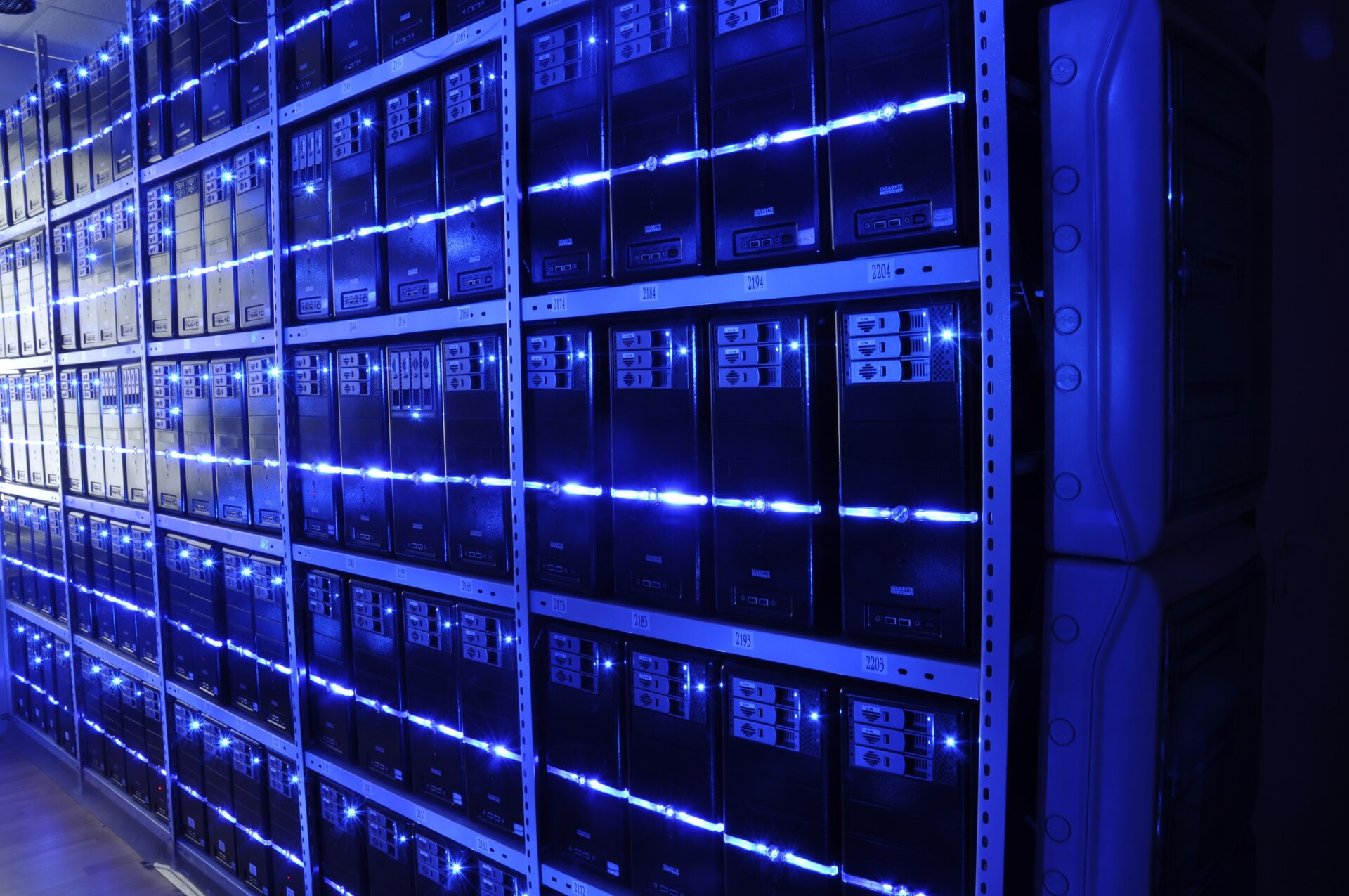 Server racks with blue indicator lights in a data center