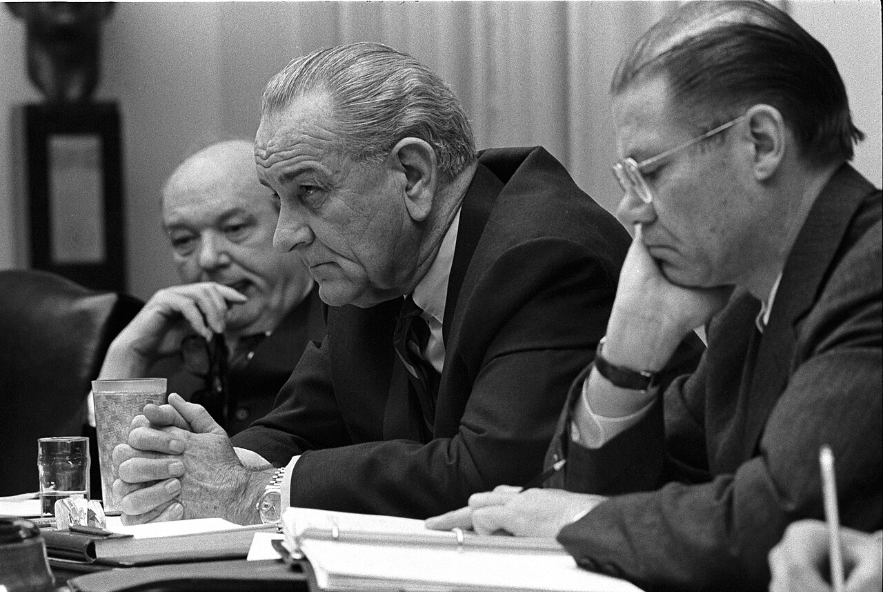 A formal meeting in a government cabinet room