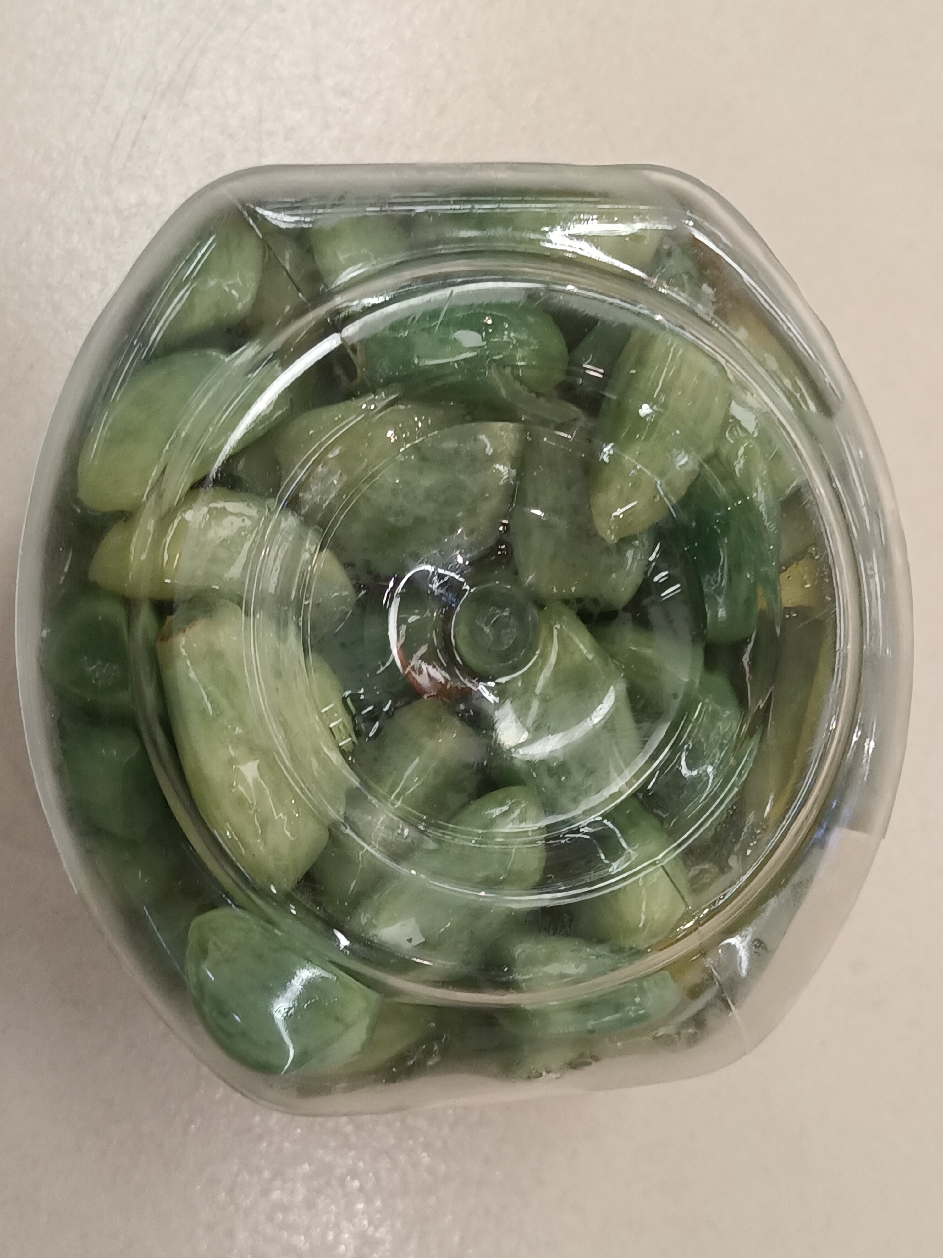 Green pickled laba garlic in a bowl