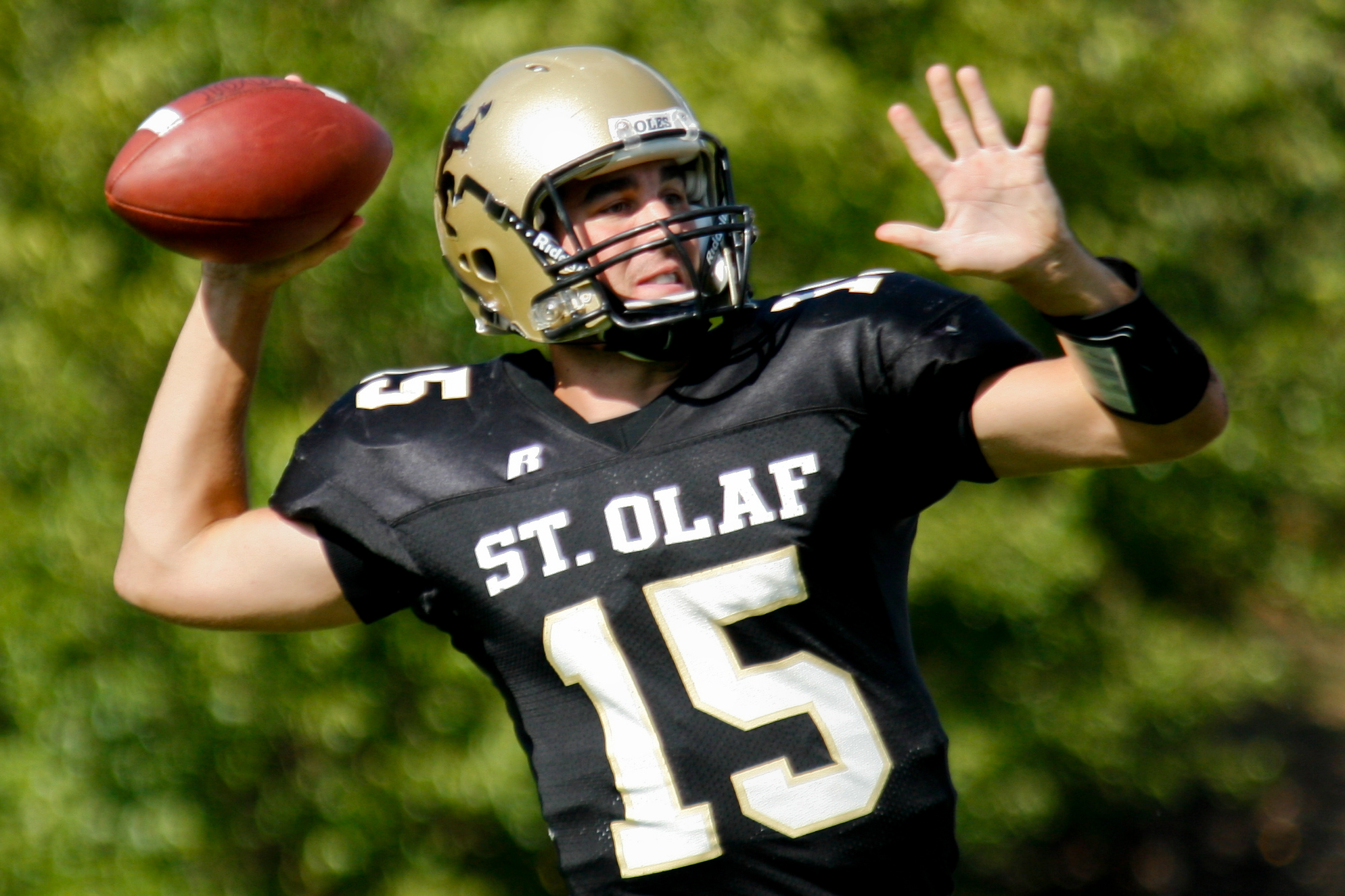 Players fight for the ball during a college football game