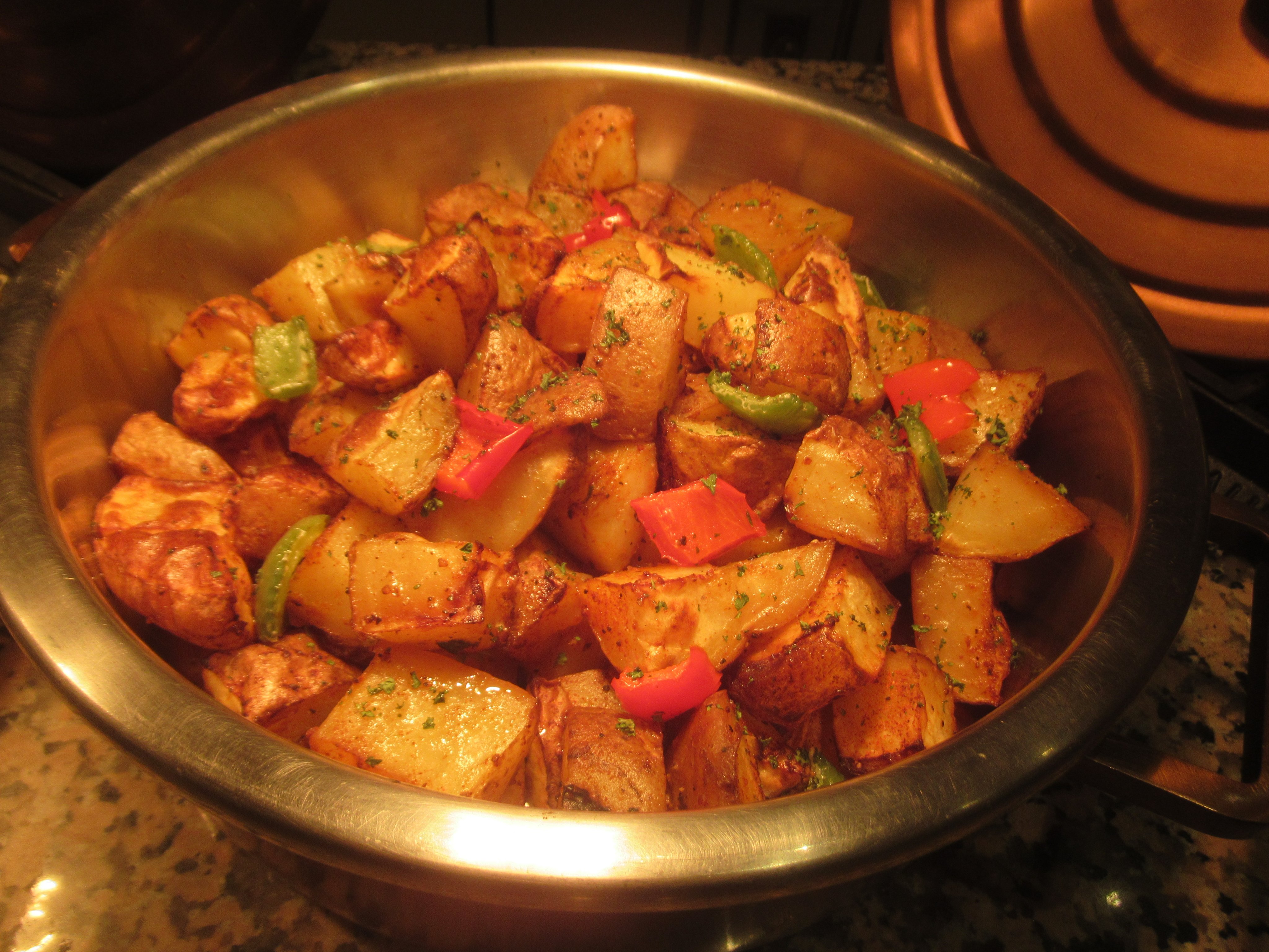 Roasted potatoes with chicken on a tray