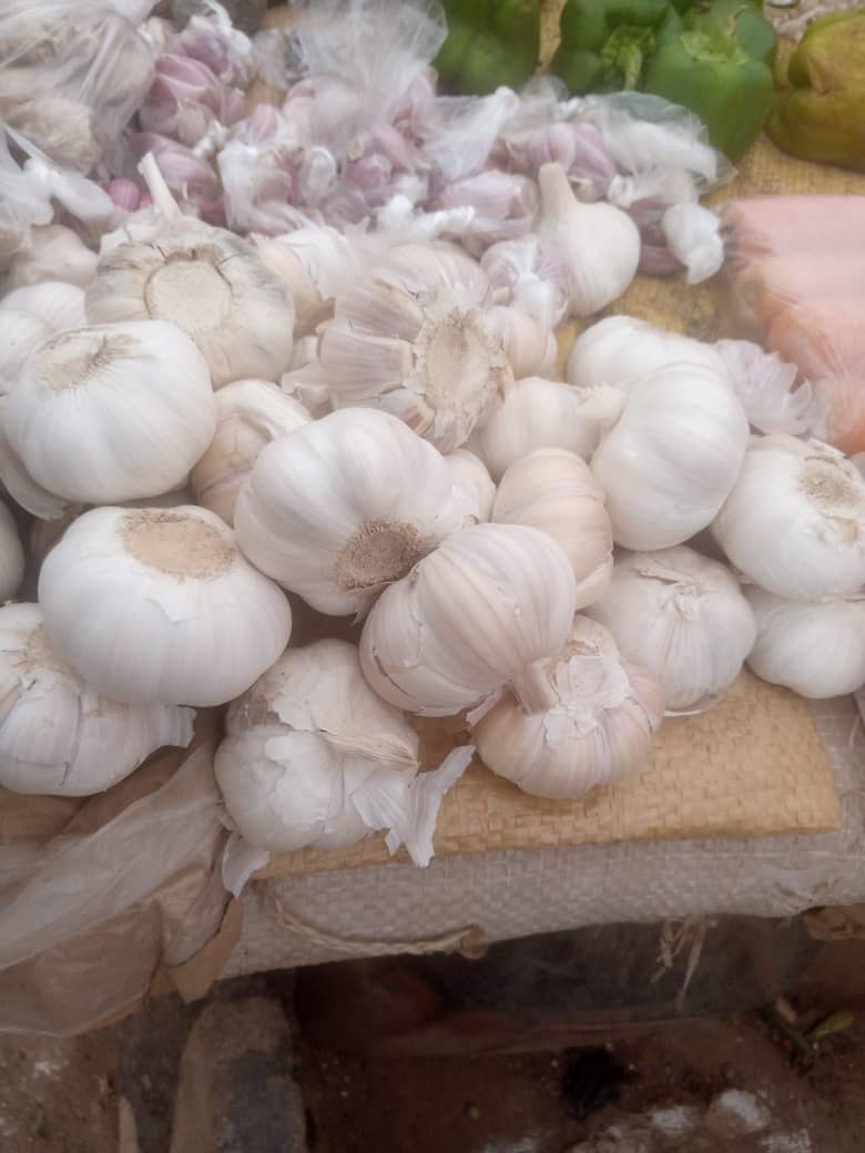 Garlic bulbs piled at a local market stall