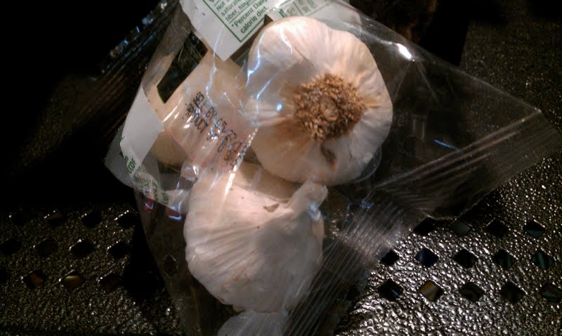 Garlic bulbs in a supermarket bag