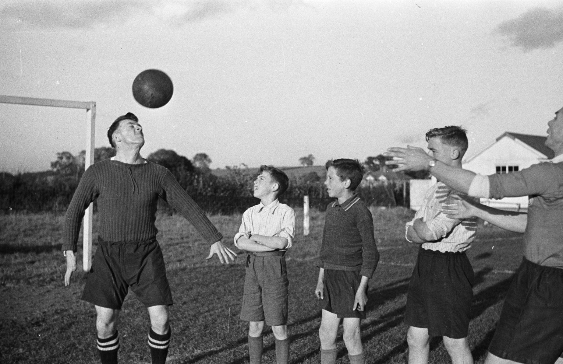 Young football players training on a grass pitch