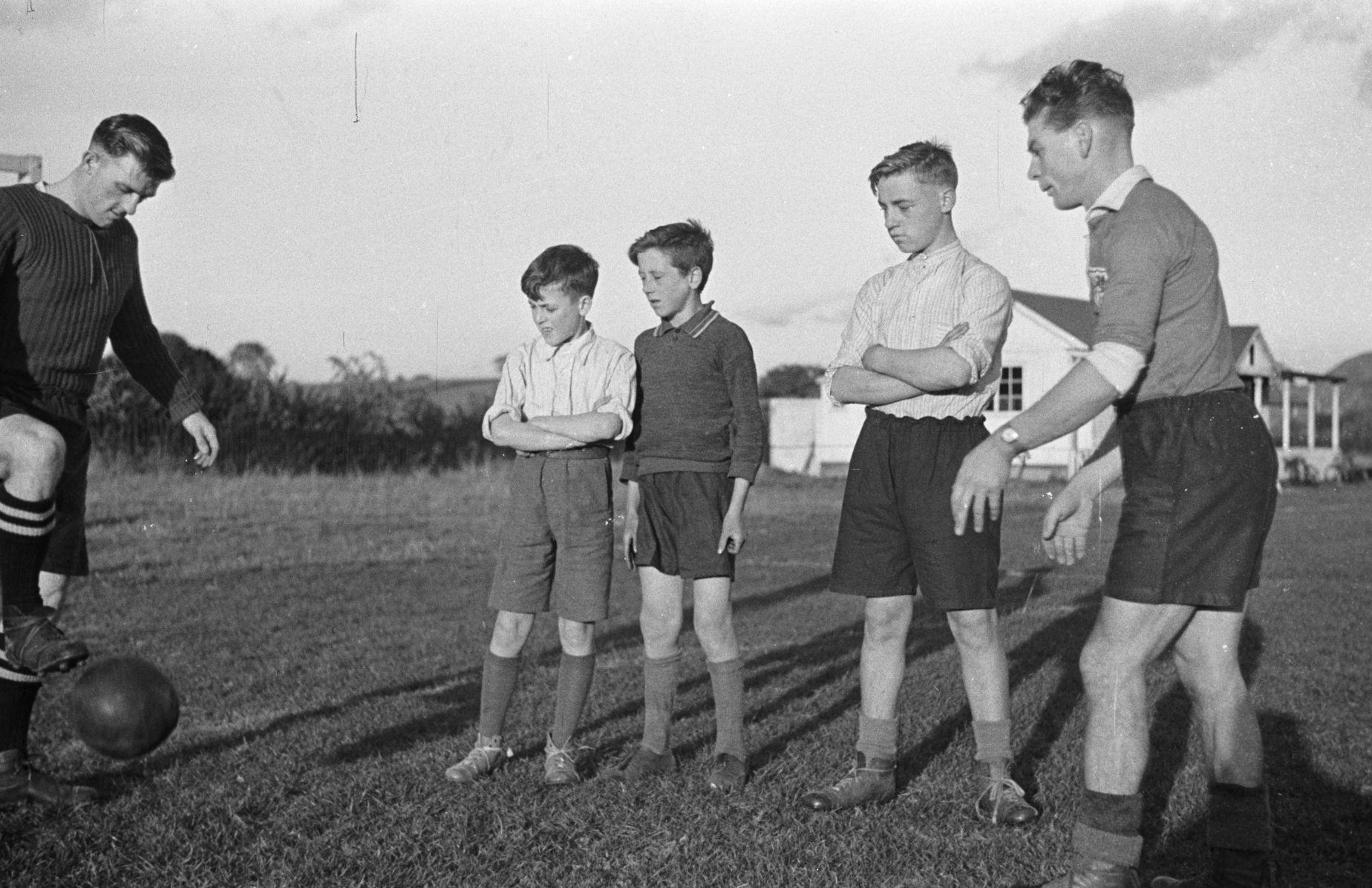 Young players watching a drill during a training session