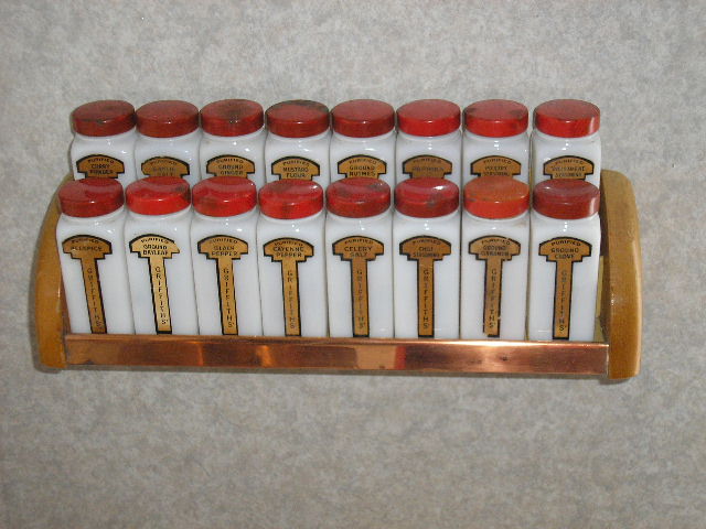 A vintage set of labelled spice jars in a row