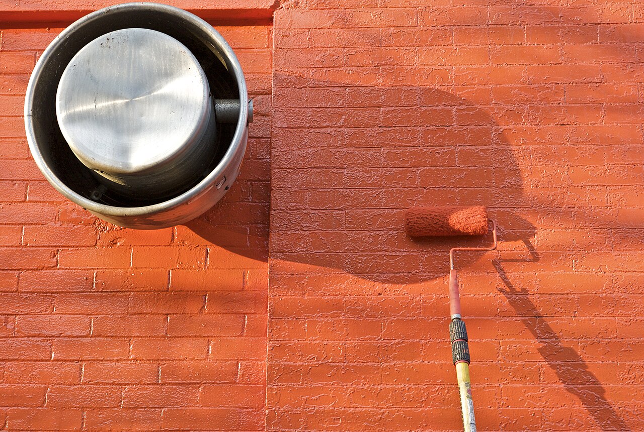 A paint roller, the tool that turns a stored can into a finished touch-up