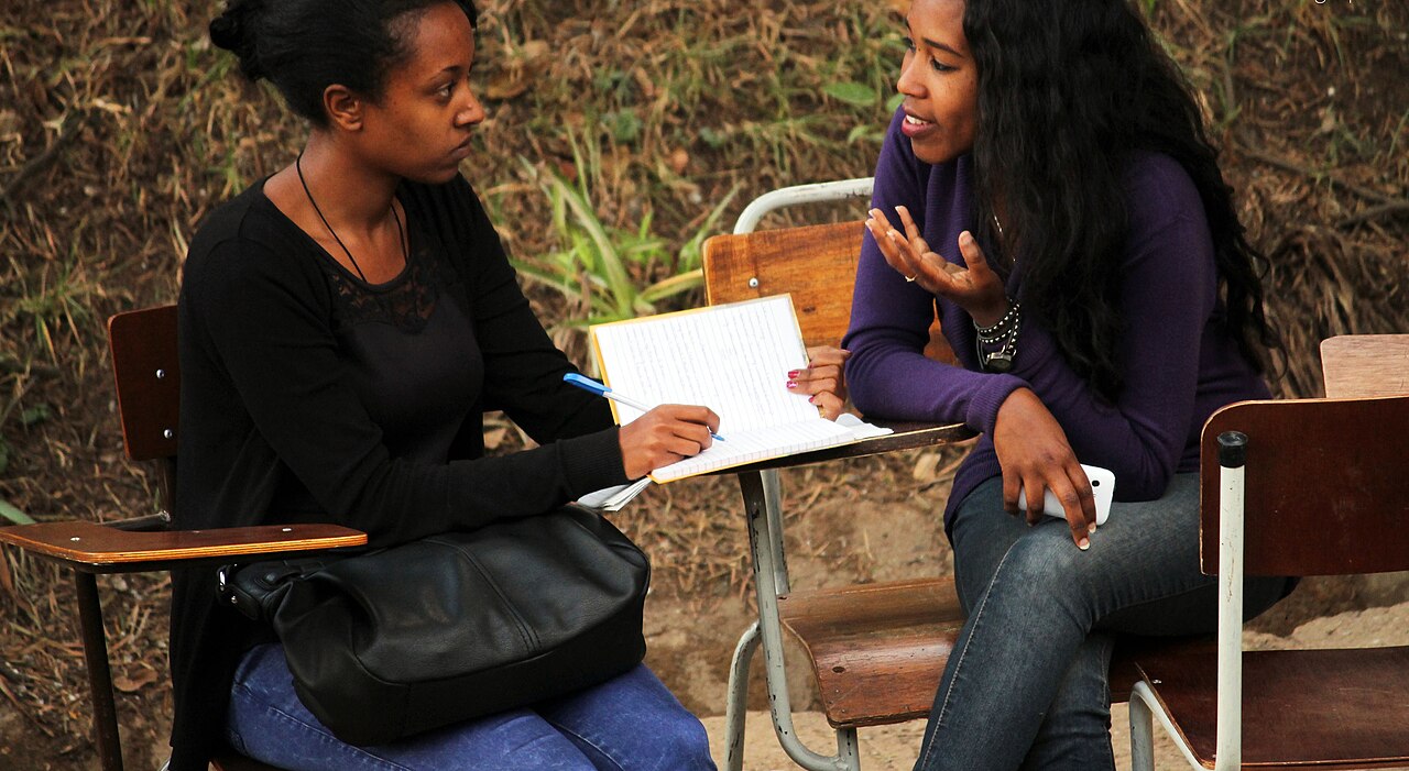 Students meeting to discuss their work together