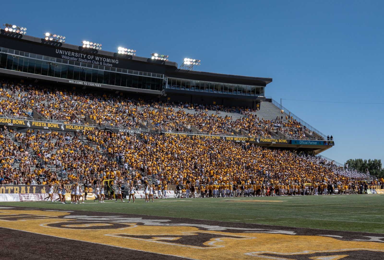 College football fans pack a large stadium for a game