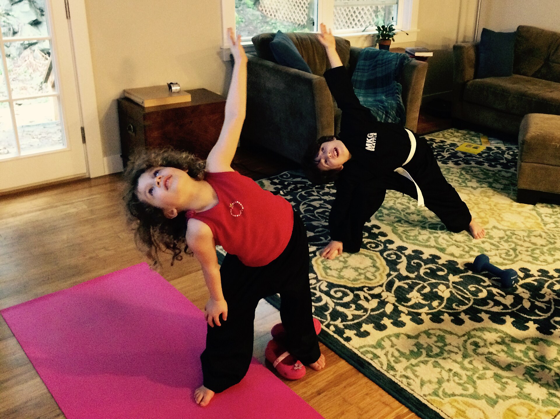 Children performing stretching exercises during a GoNoodle video