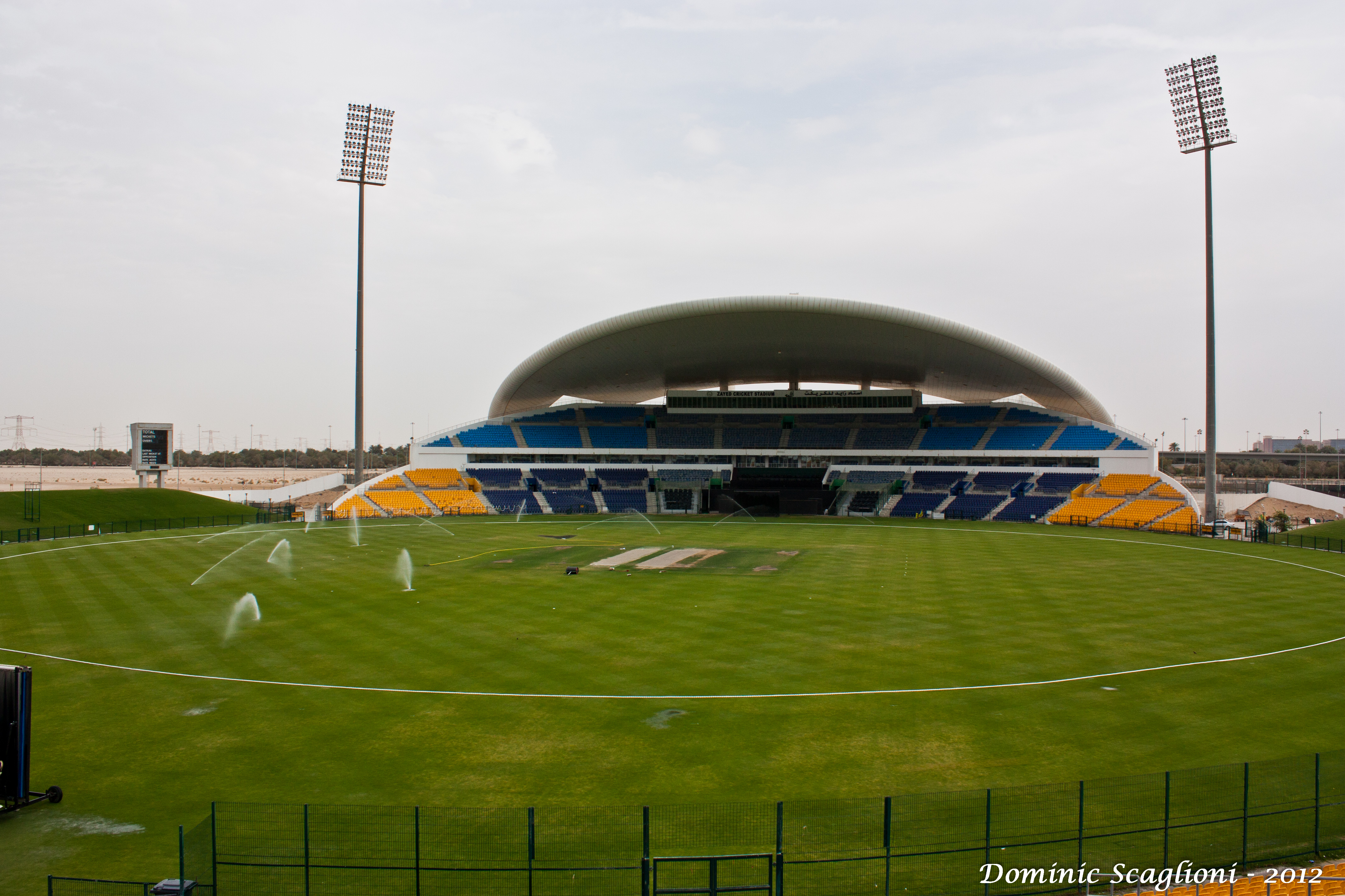 Sheikh Zayed Cricket Stadium in Abu Dhabi with stands and floodlights