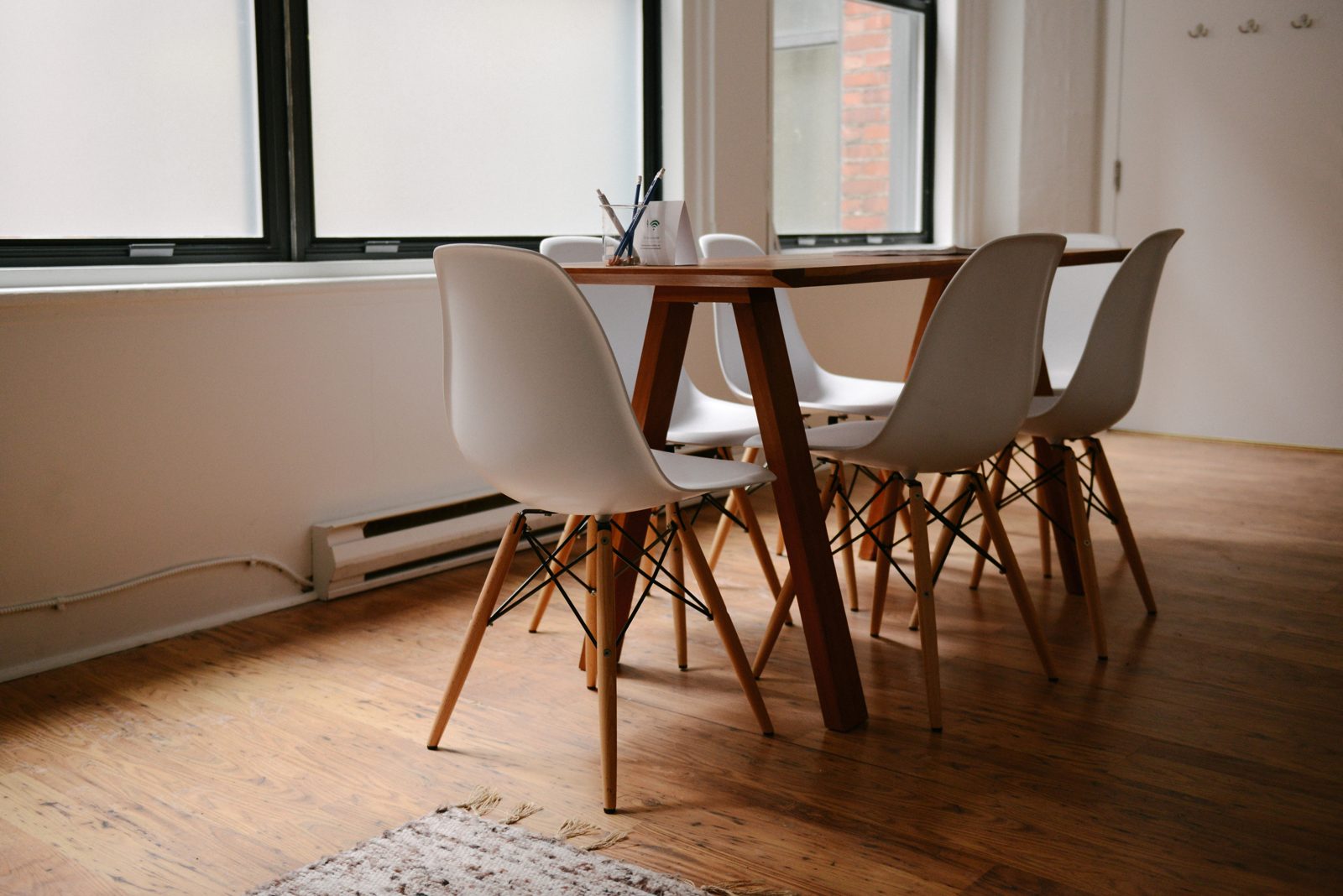 An empty meeting room with chairs around a table