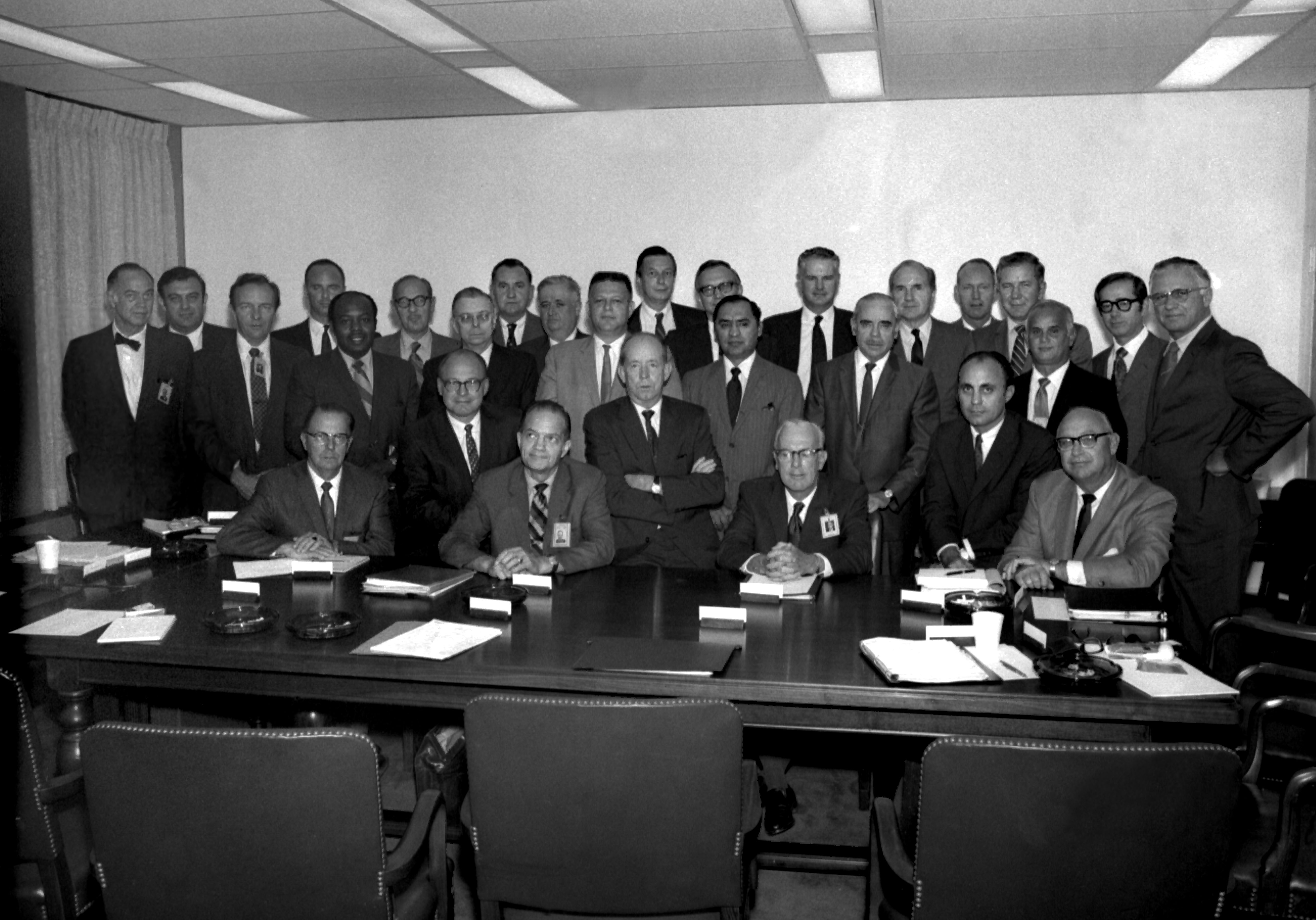 Managers seated around a table in a meeting