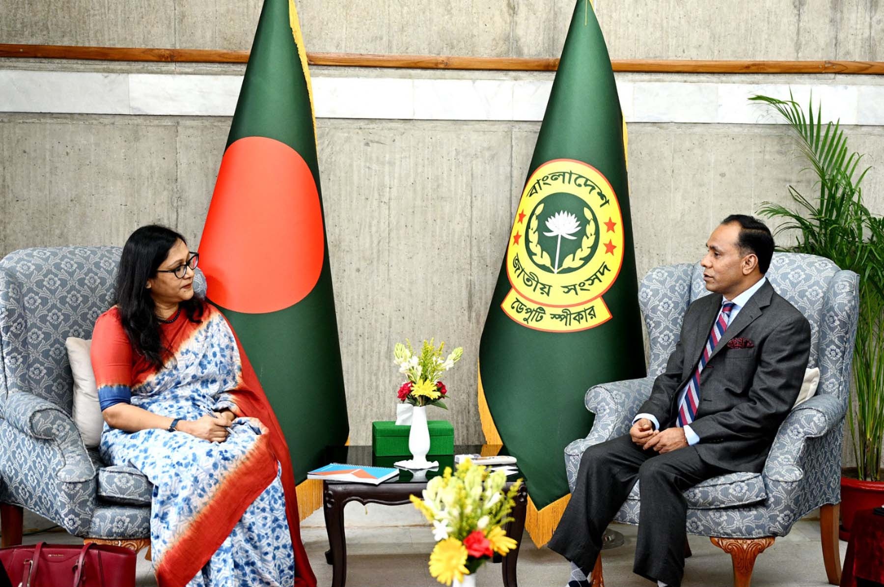 Two officials meeting at a table
