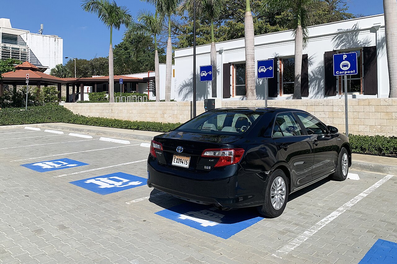A hybrid car in a dedicated parking space