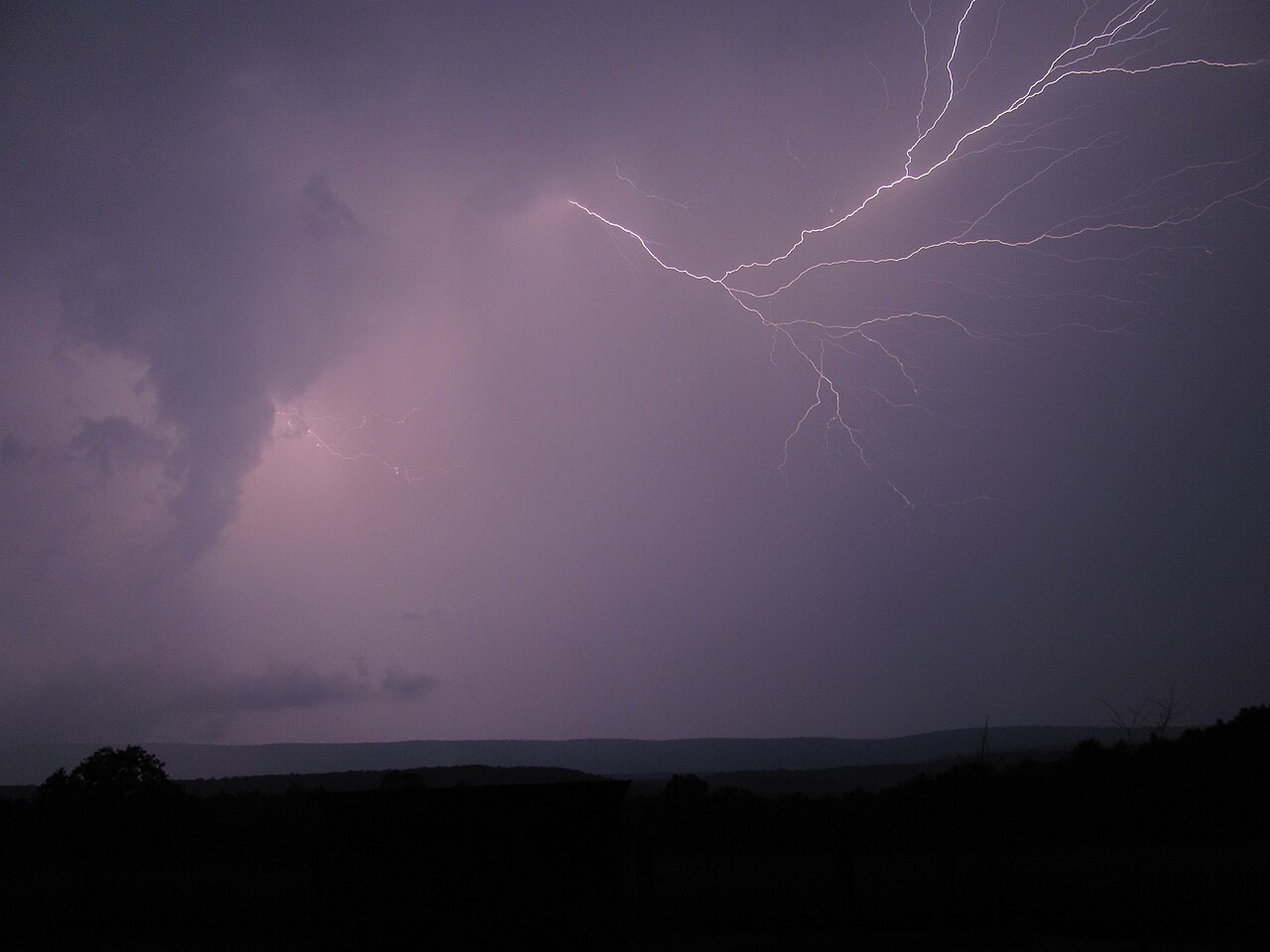 Lightning over a mountain ridge during a storm