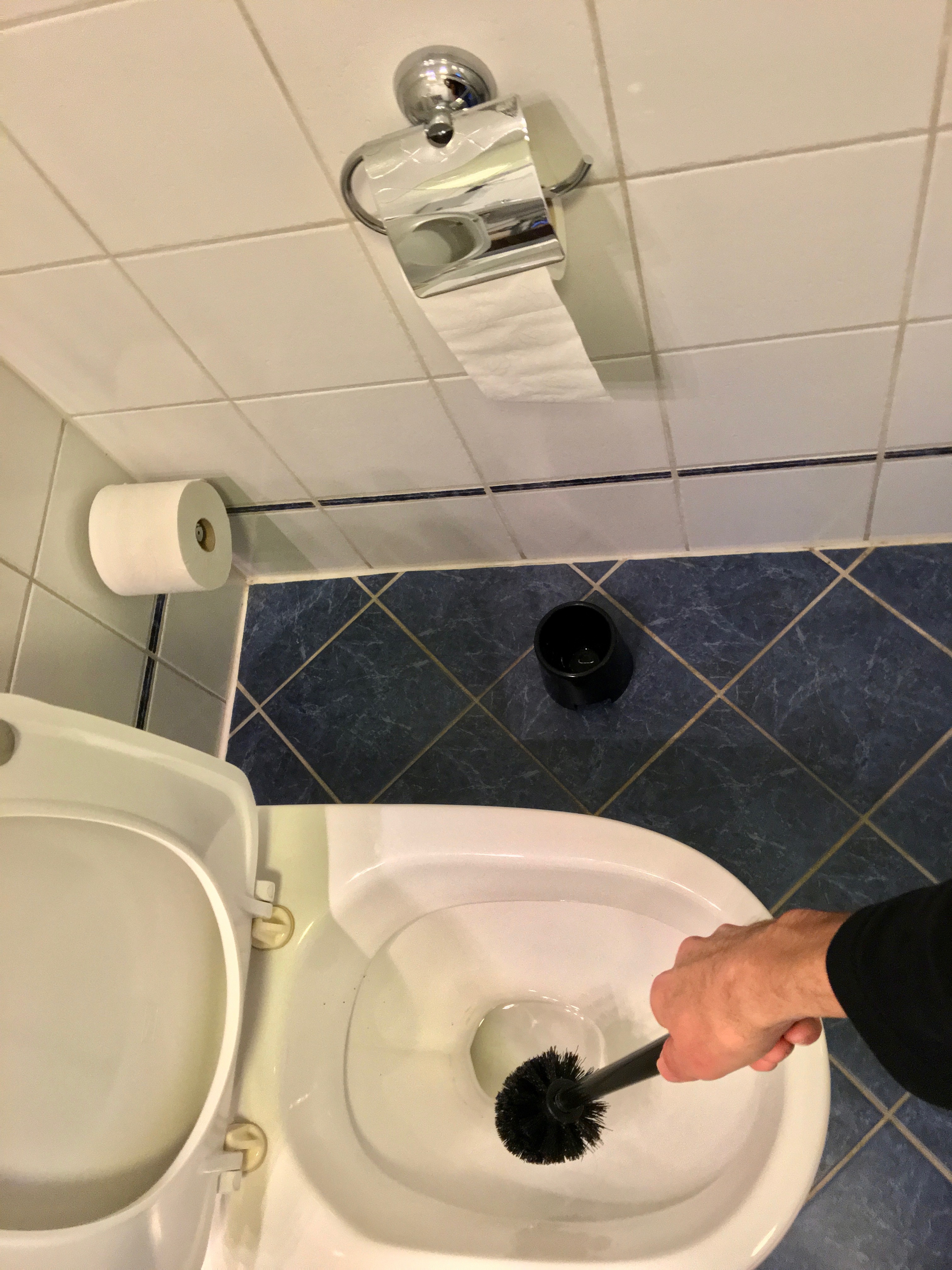 A bathroom with tiled walls and floor