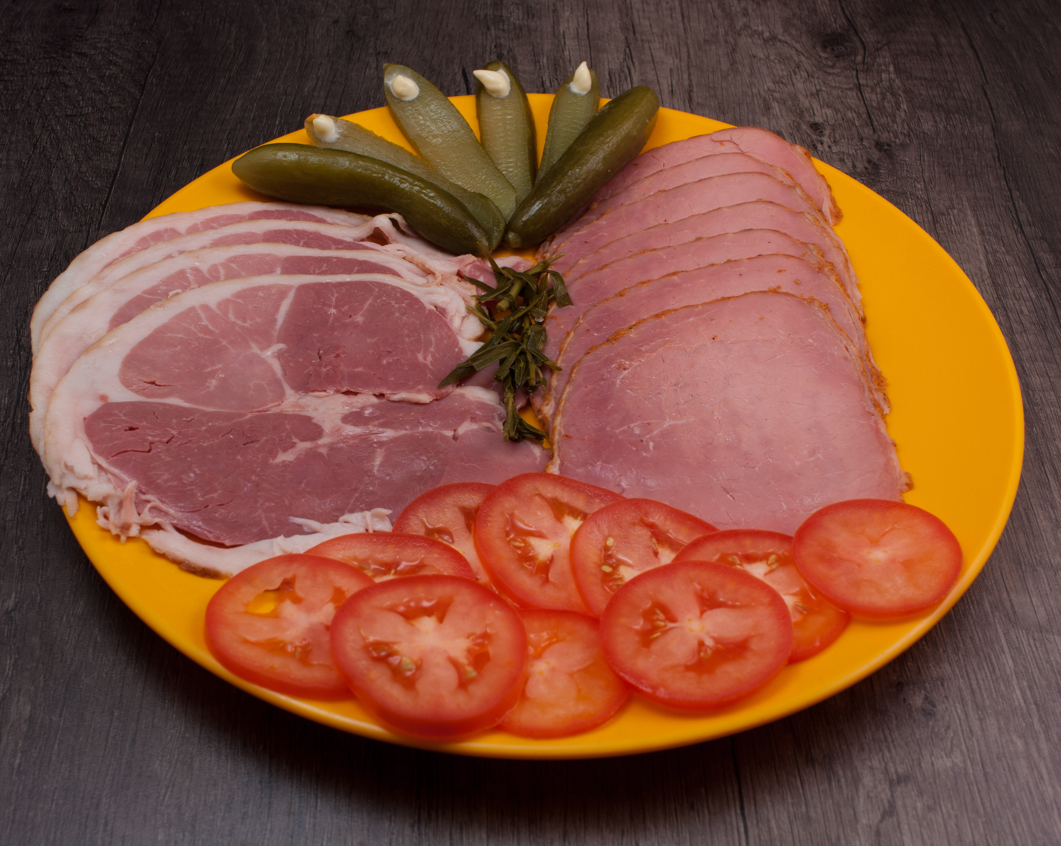 Sliced cold cuts on a board