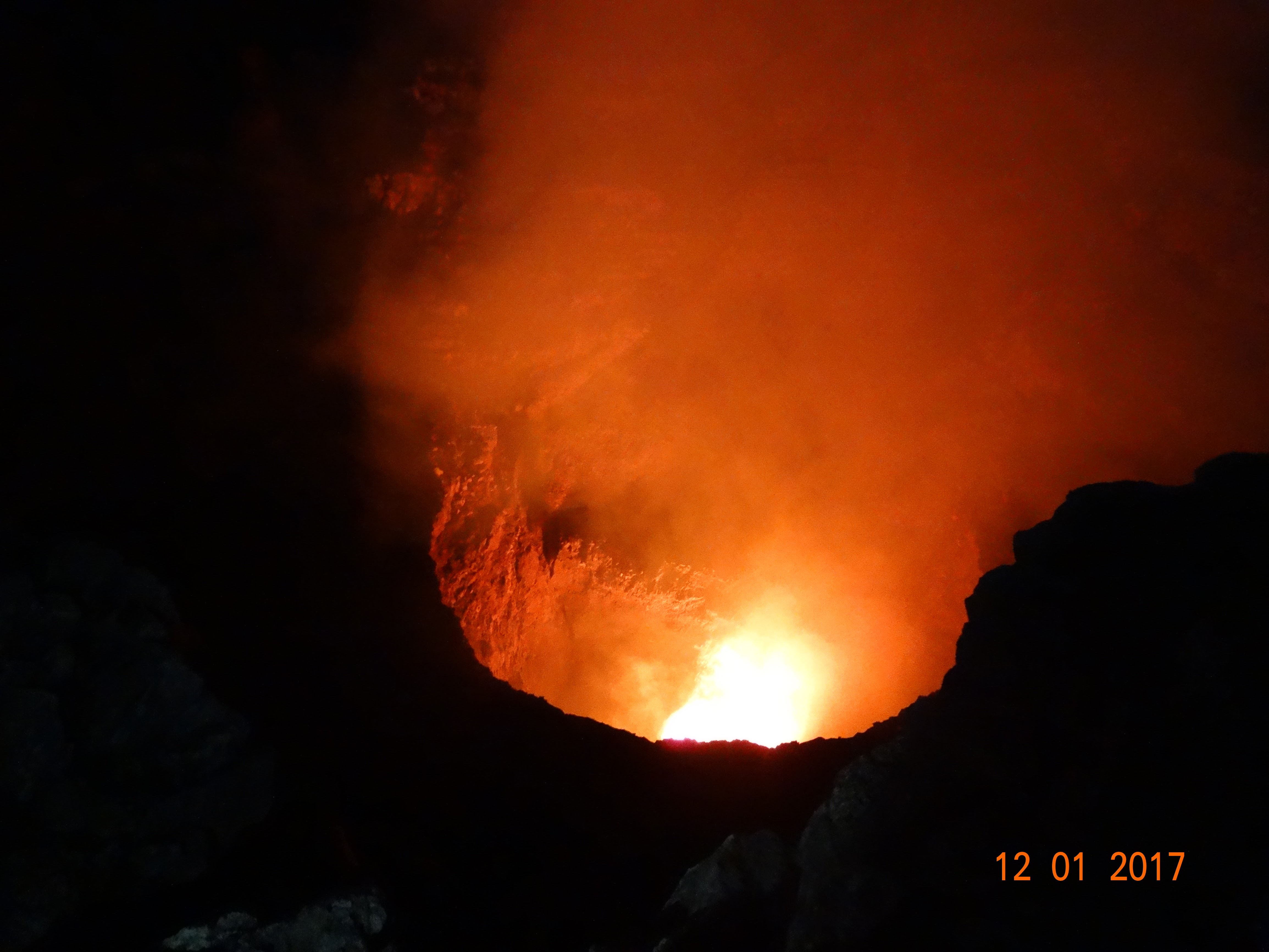 Glowing lava inside the crater of Masaya volcano at night