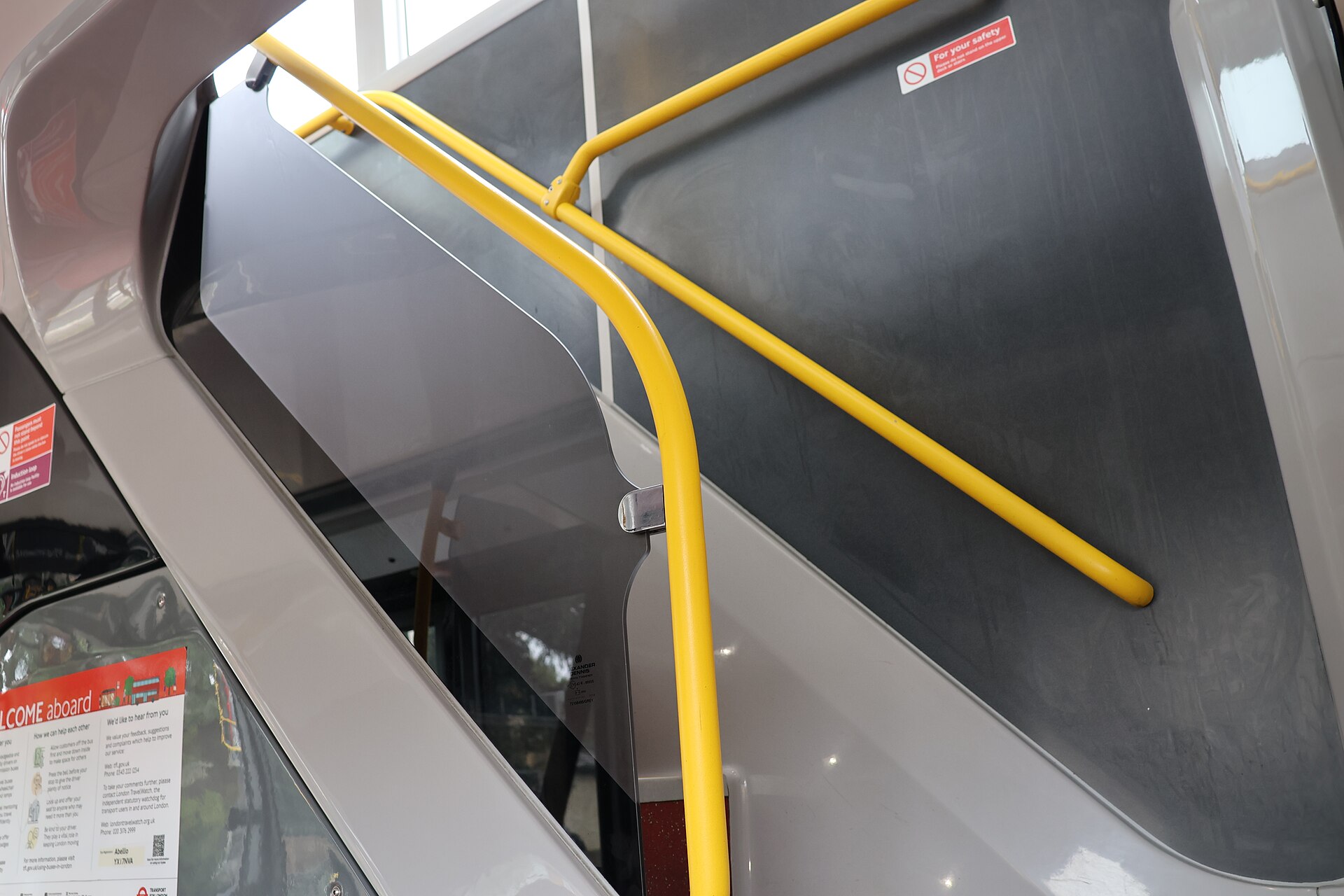Inside of a London bus with rows of empty seats