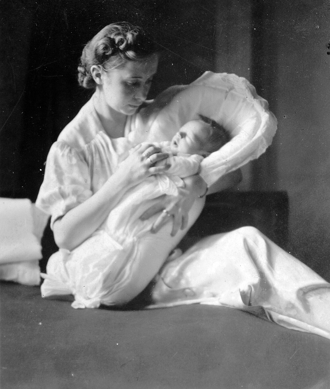 A mother holding her newborn baby