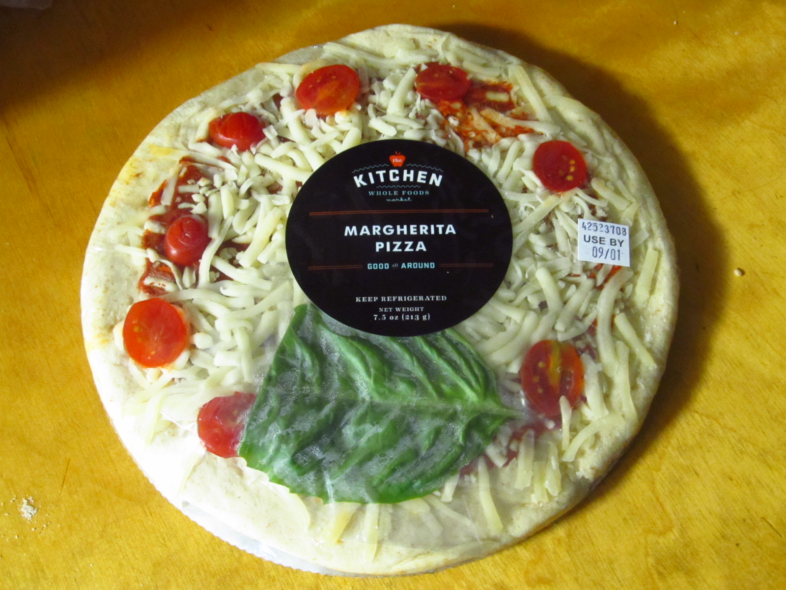 A whole margherita pizza, the kind of leftover that reheats best with direct bottom heat