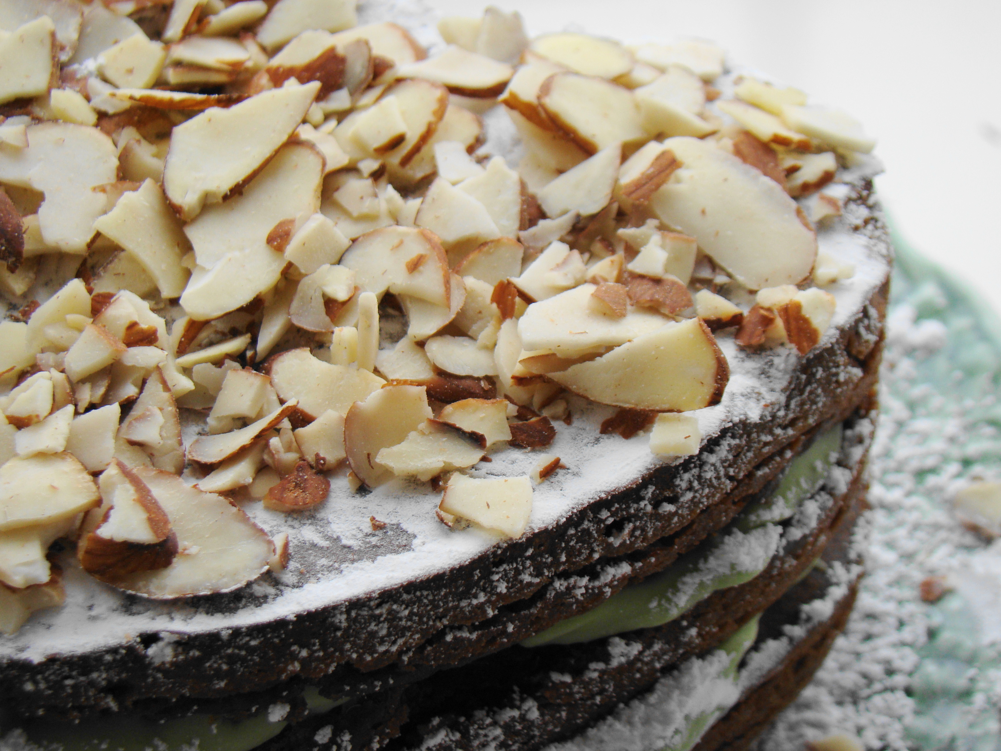 A frosted layer cake ready to slice, showing the finished structure a stable bake produces