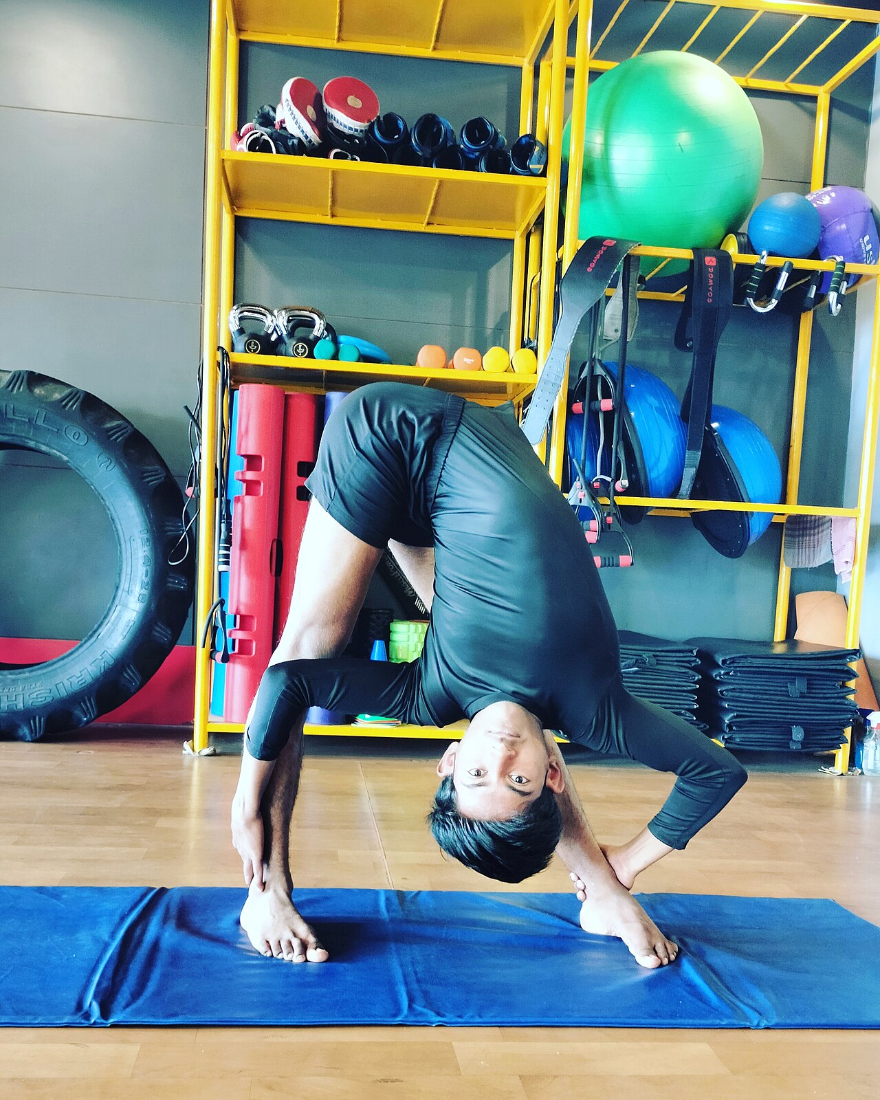 A person practicing a yoga pose for flexibility and balance
