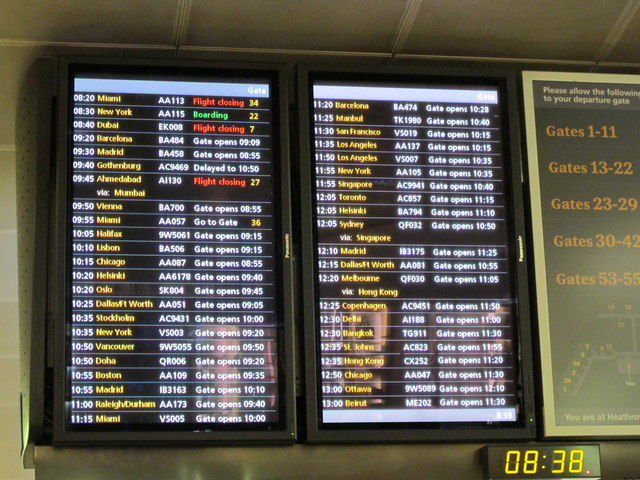 An airport departure board showing flight numbers, times, and gate information