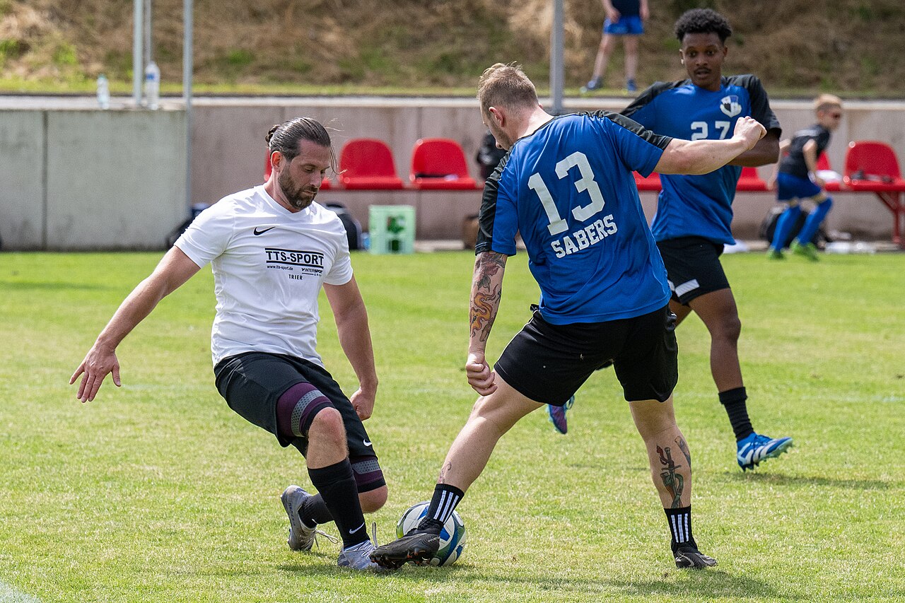 Two players contesting the ball in a soccer match