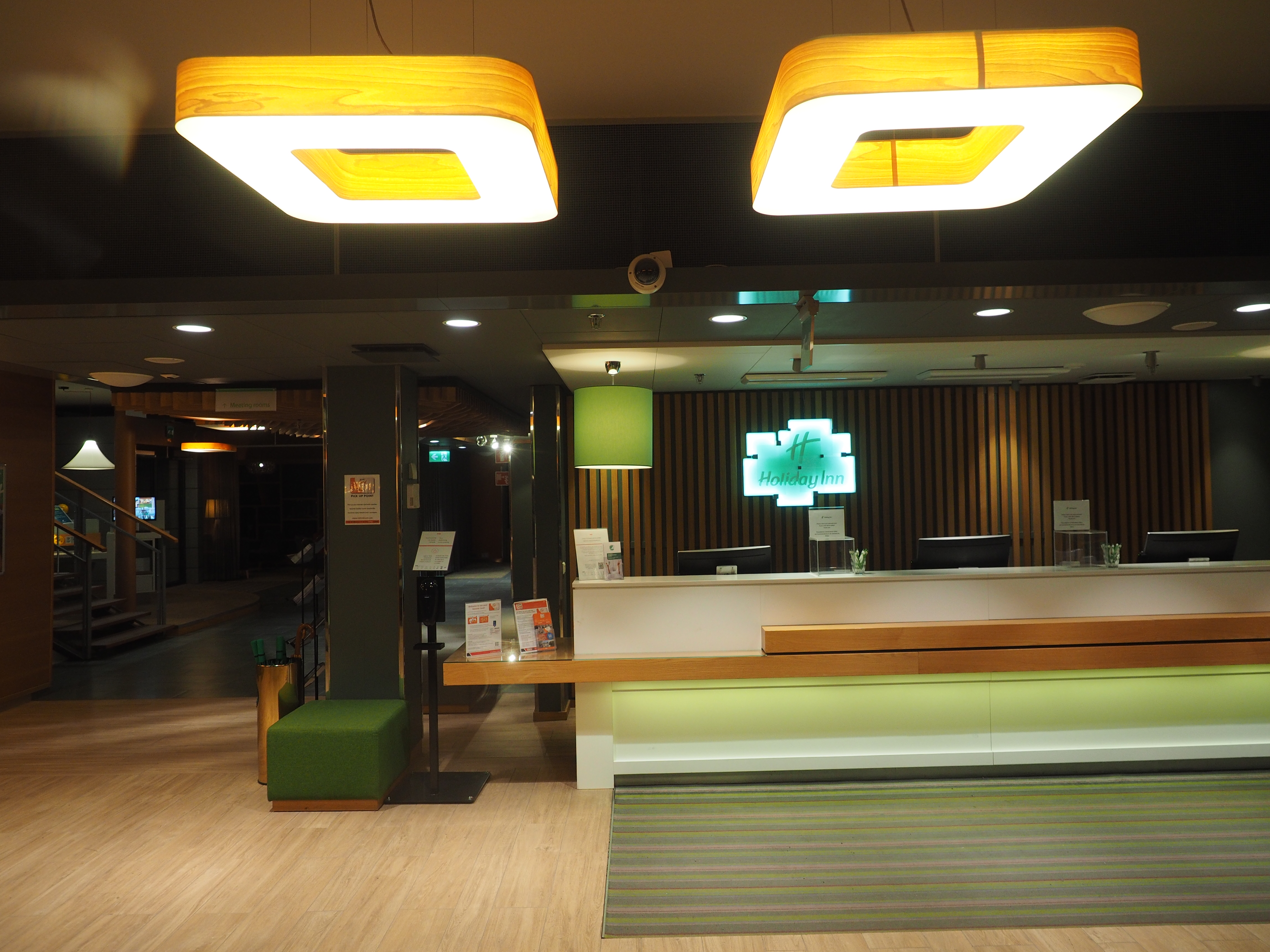 A hotel reception desk in a lobby, the point where the incidental hold is arranged
